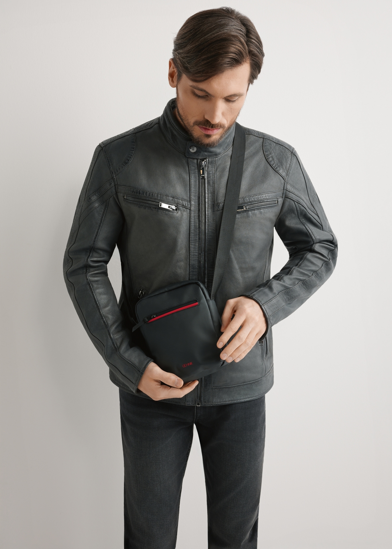 Black men's bag TORMN-0400-9J(W26), product view on the model's silhouette, on a light background.