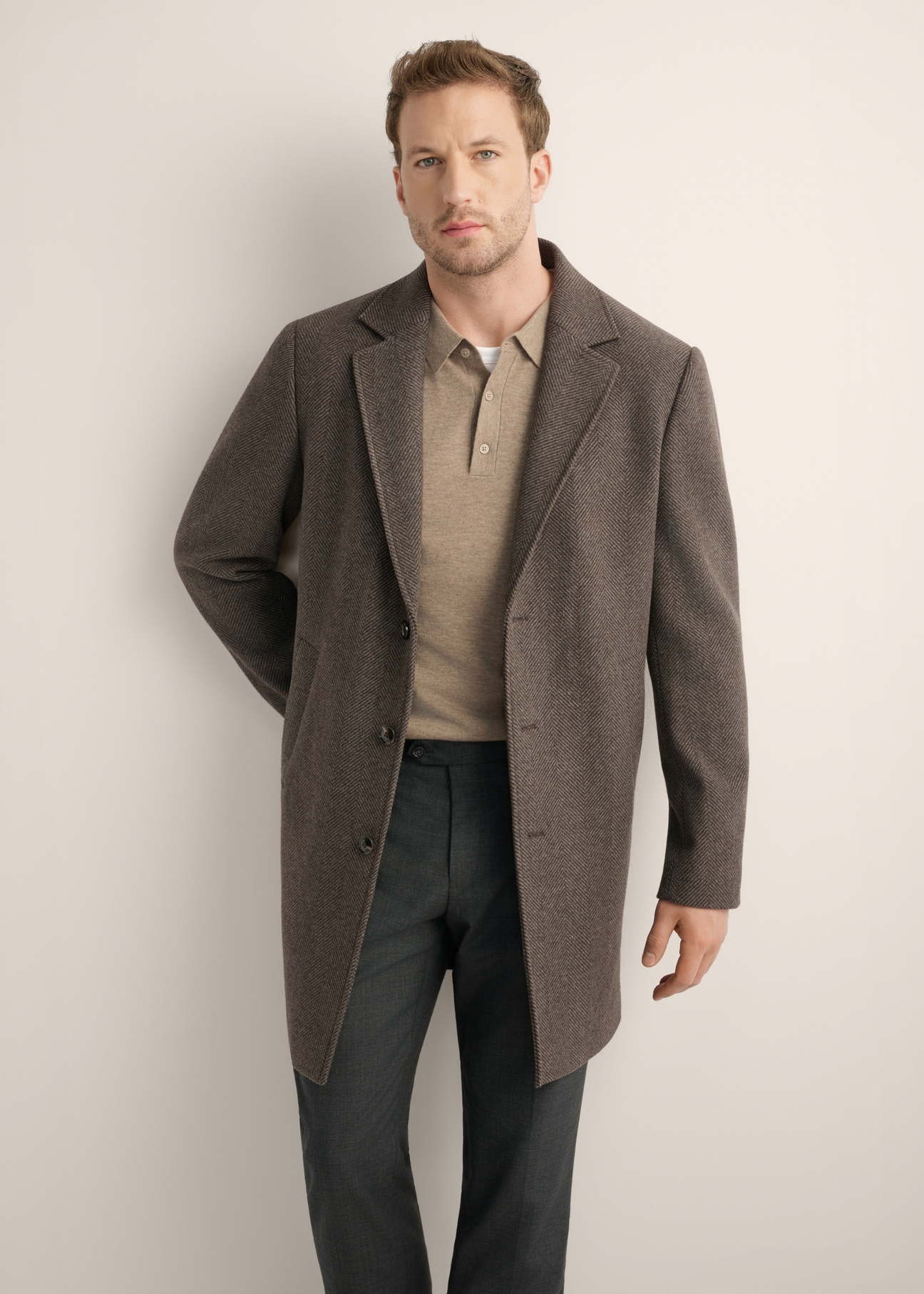 Men's wool herringbone coat PLAMT-0006-9C(Z26), front view of the product on the model. Half of the silhouette visible.
