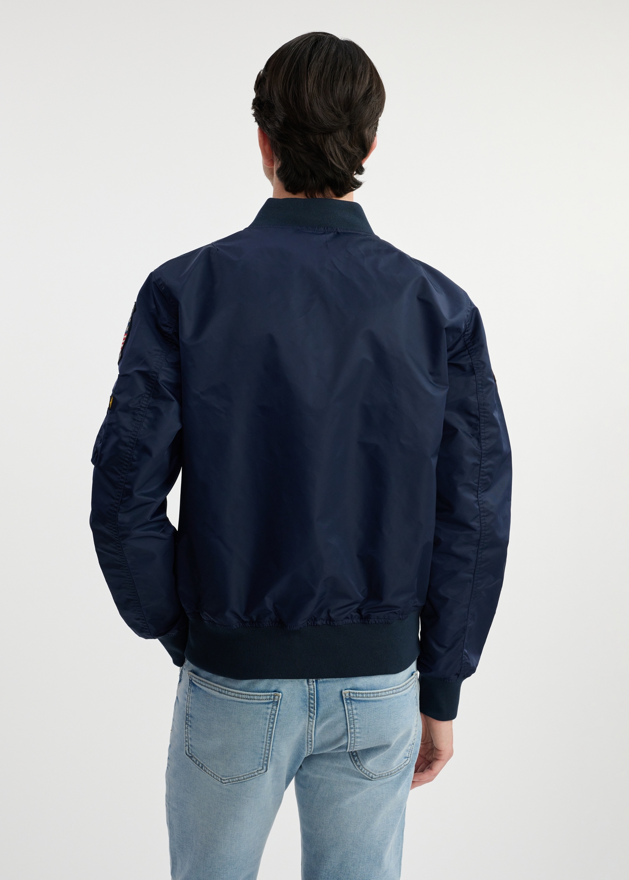 Navy men's TOP GUN KURMT-0381-69(W25) pilot jacket - back view on model on white background. Half of the silhouette visible.