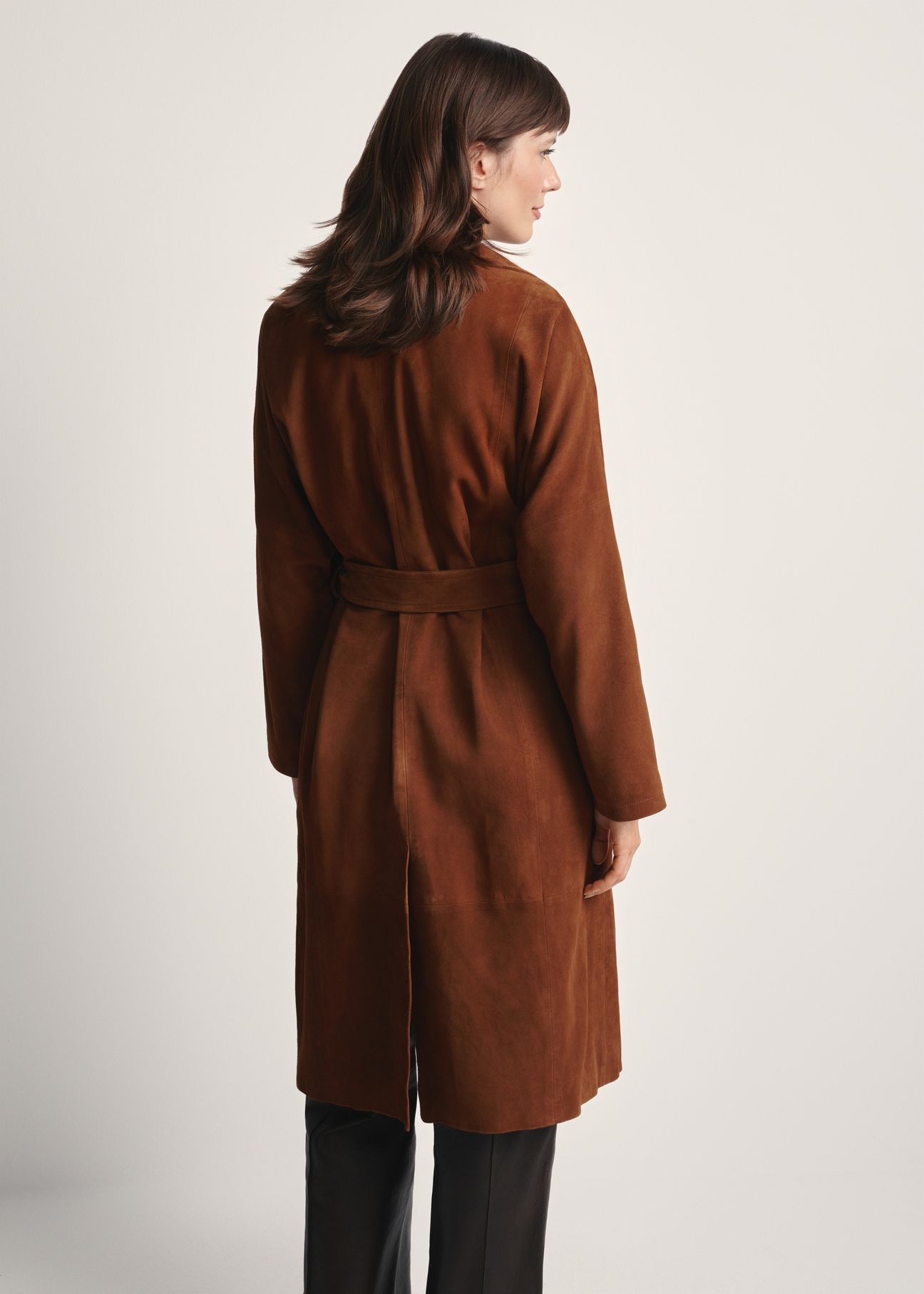 Women's brown oversized suede coat KURDS-0551-0775(Z25), back view of the product on the model. Half of the silhouette visible.
