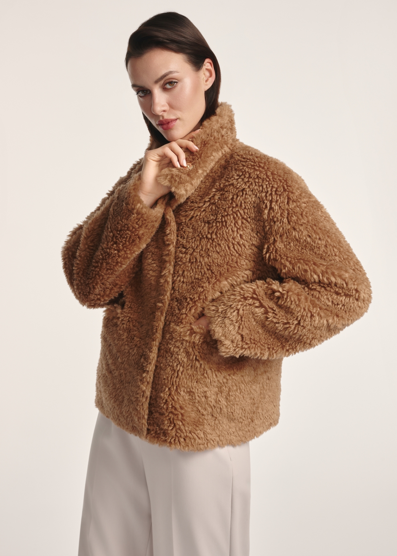 Women's brown fur coat FUTDP-0021B-89(Z25), front view of the product on a model. Half of the silhouette visible.