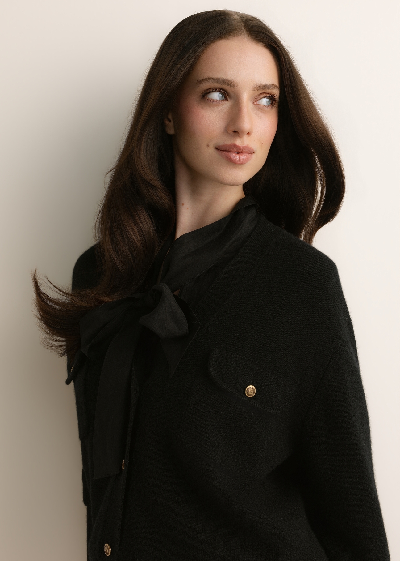 Black women's wool cardigan KARDT-0070-99(Z26), close-up of the product, on the model's silhouette.