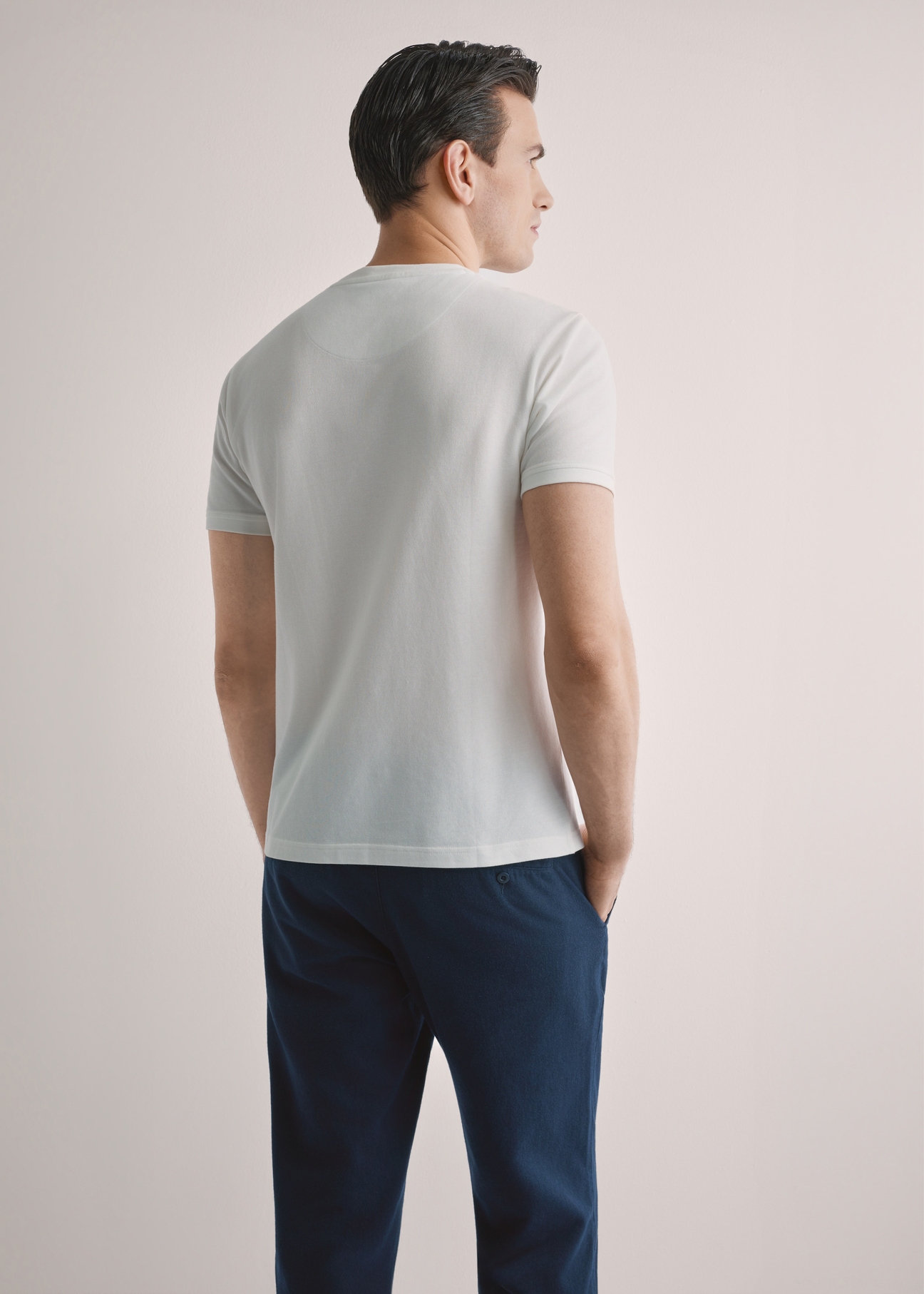 Men's cream cotton t-shirt TSHMT-0136-0B(W26), back view of the product on the model. Half of the silhouette visible.