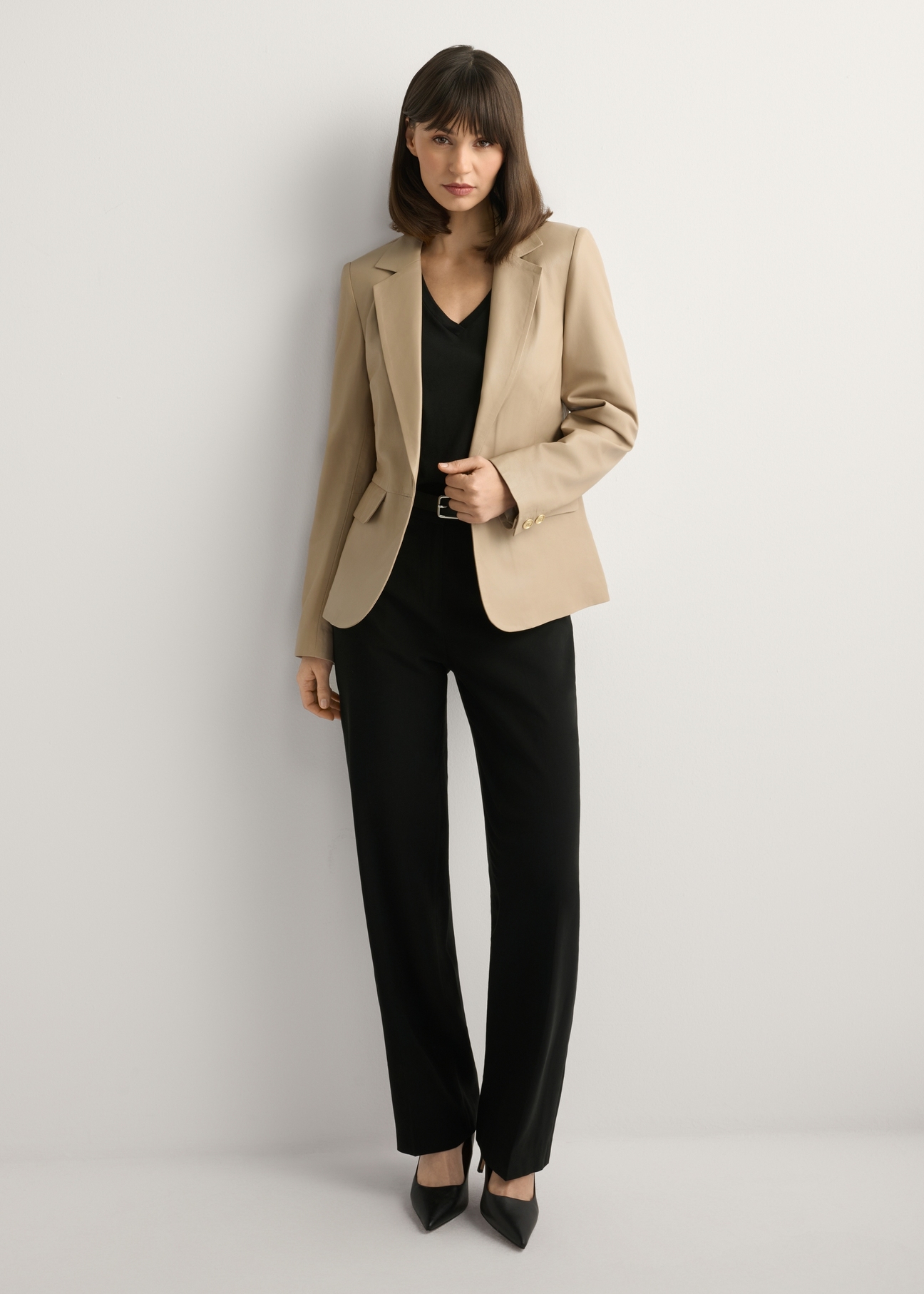 Beige women's leather jacket KURDS-0445-1B(W26), front view of the product on the model. Full body visible.