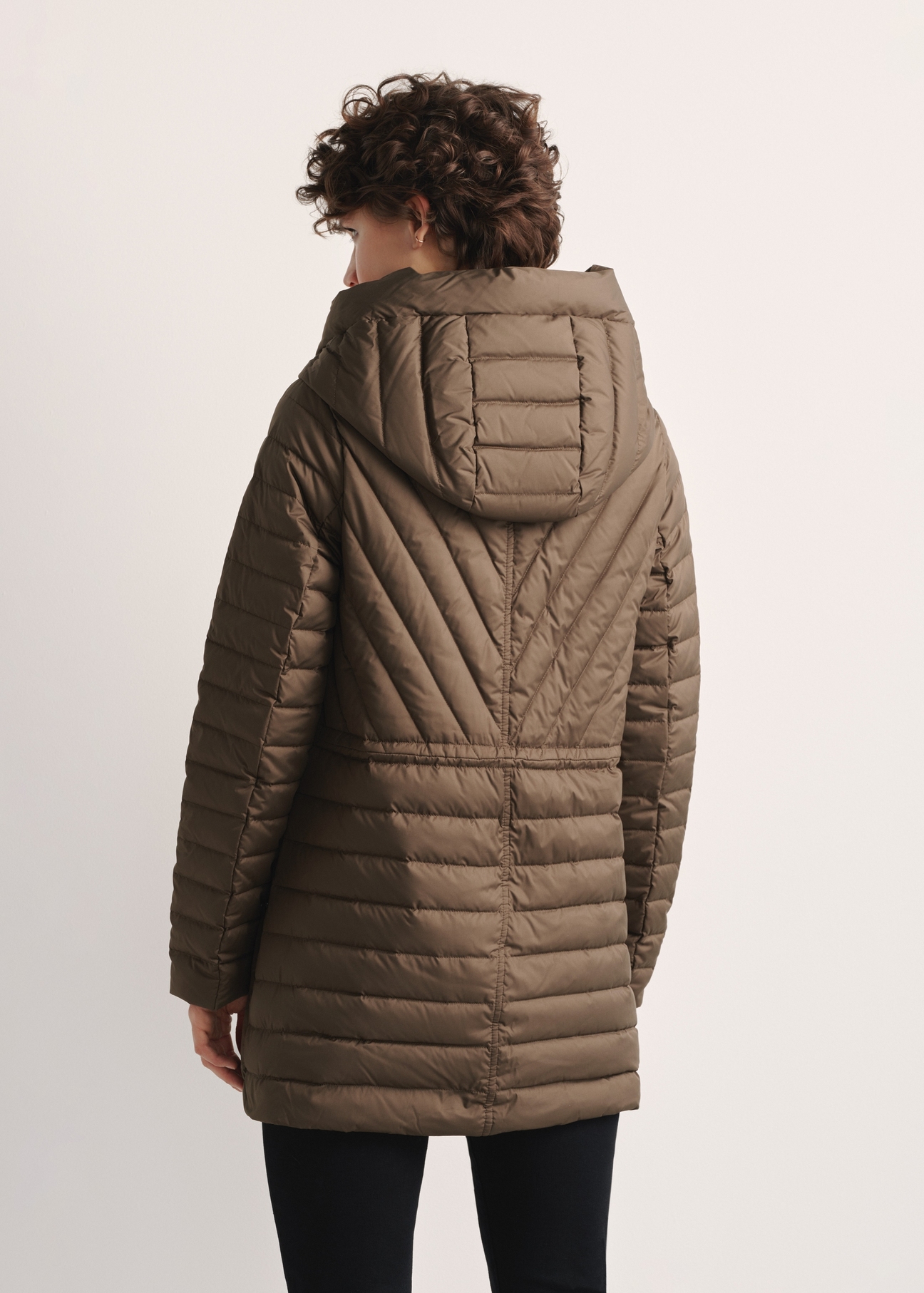 Brown women's quilted jacket KURDT-0524-89(Z25), product view from the back on the model. Half of the silhouette visible.