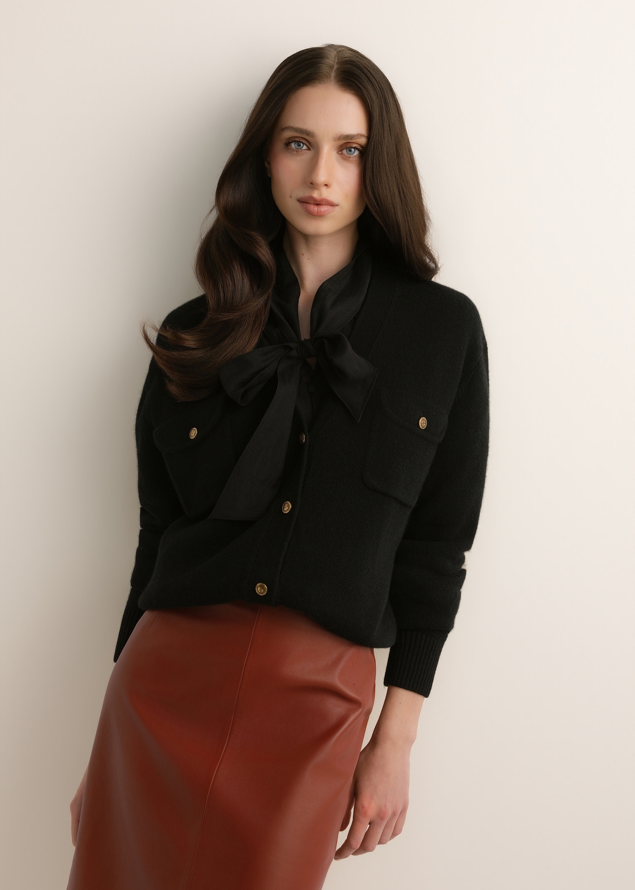 Women's black wool cardigan KARDT-0070-99(Z26), front view of the product on the model. Half of the silhouette visible.