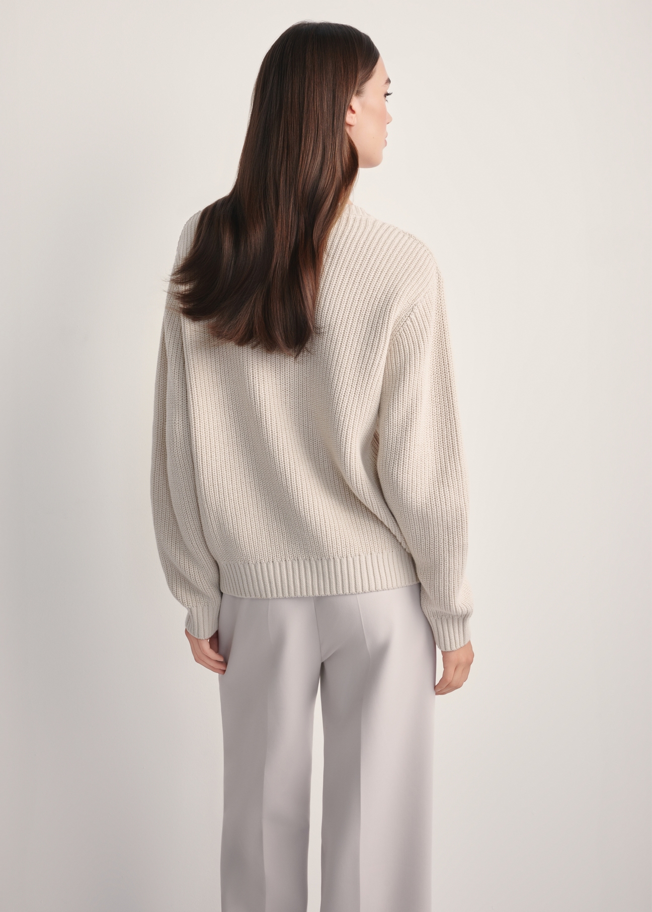 Beige women's sweater SWEDT-0238-81(Z25), back view of the product on the model. Half of the silhouette visible.