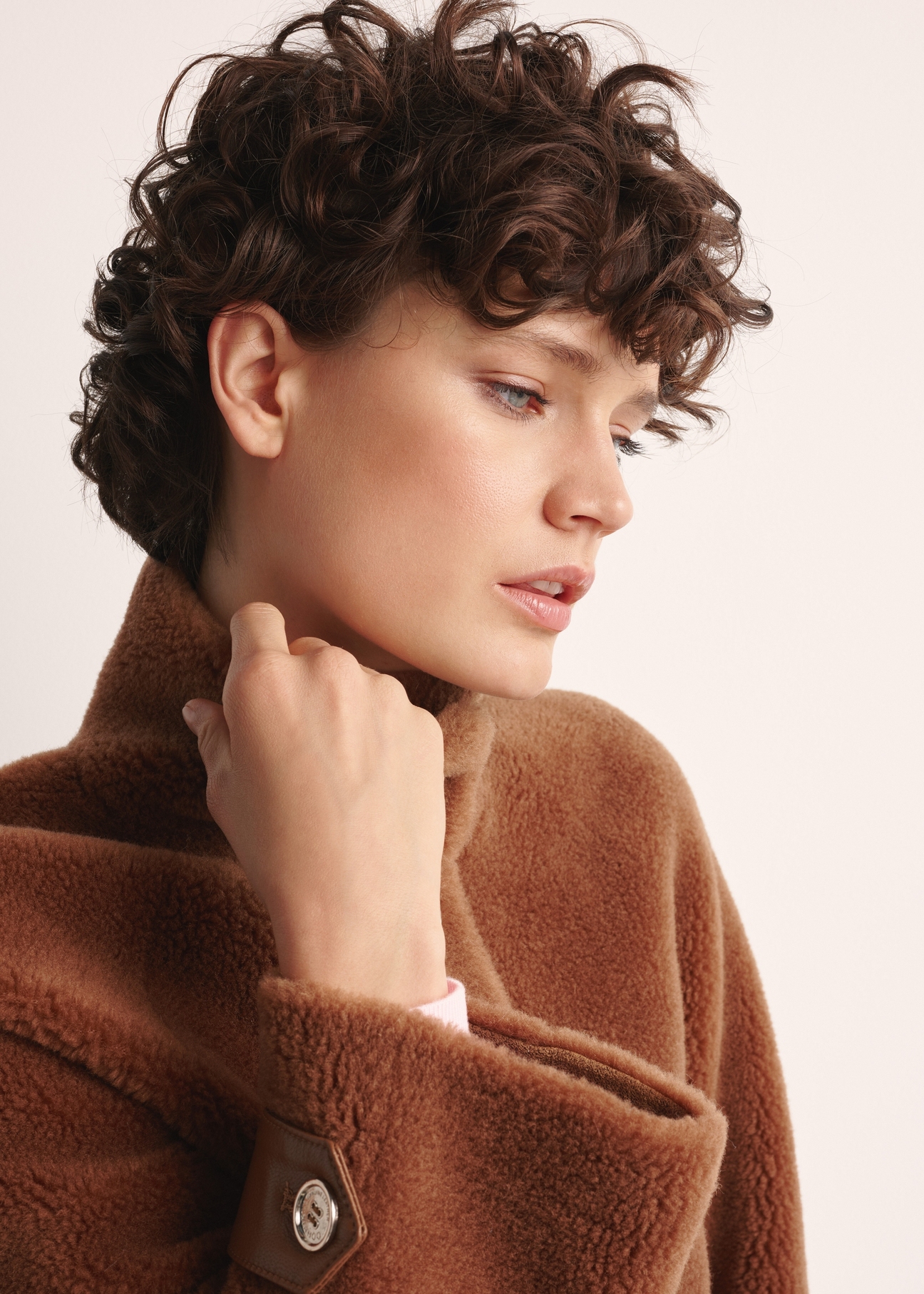 Women's woolen fur coat in camel color FUTDP-0032-24(Of 25) - close-up of detail on white background. Visible cuff.