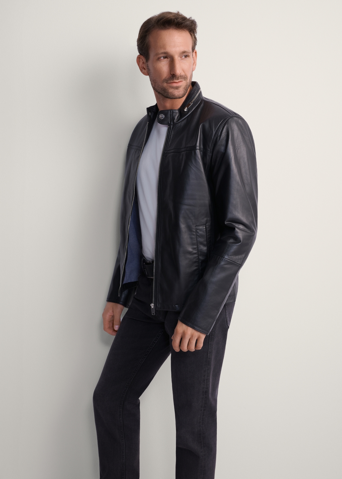 Men's leather jacket with stand-up collar KURMS-0261-5491(KS), front view of the product on the model. Half of the silhouette visible.