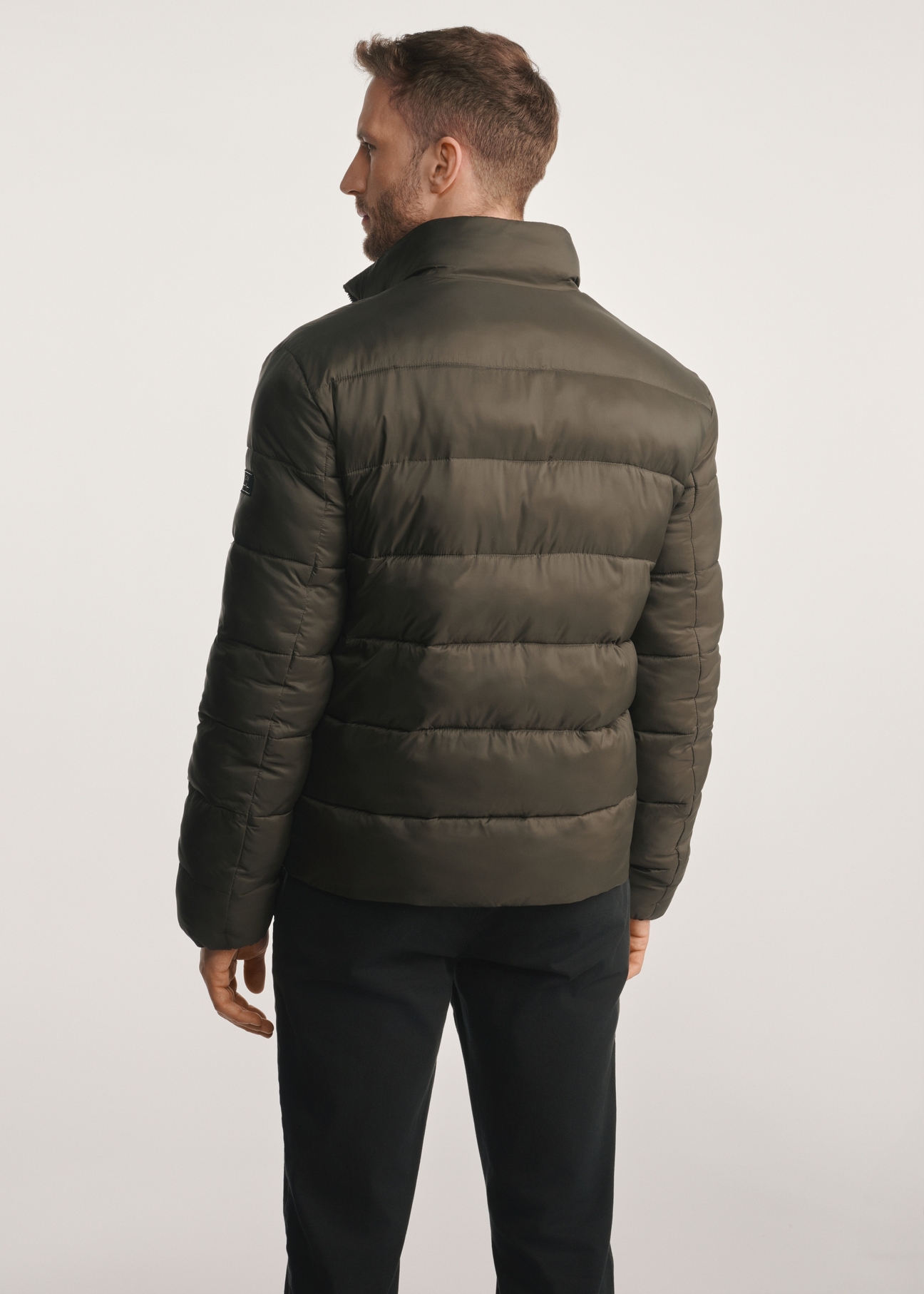 Men's olive transitional jacket KURMT-0389-57(Z25), product visible from the back on the model, half of the silhouette visible.