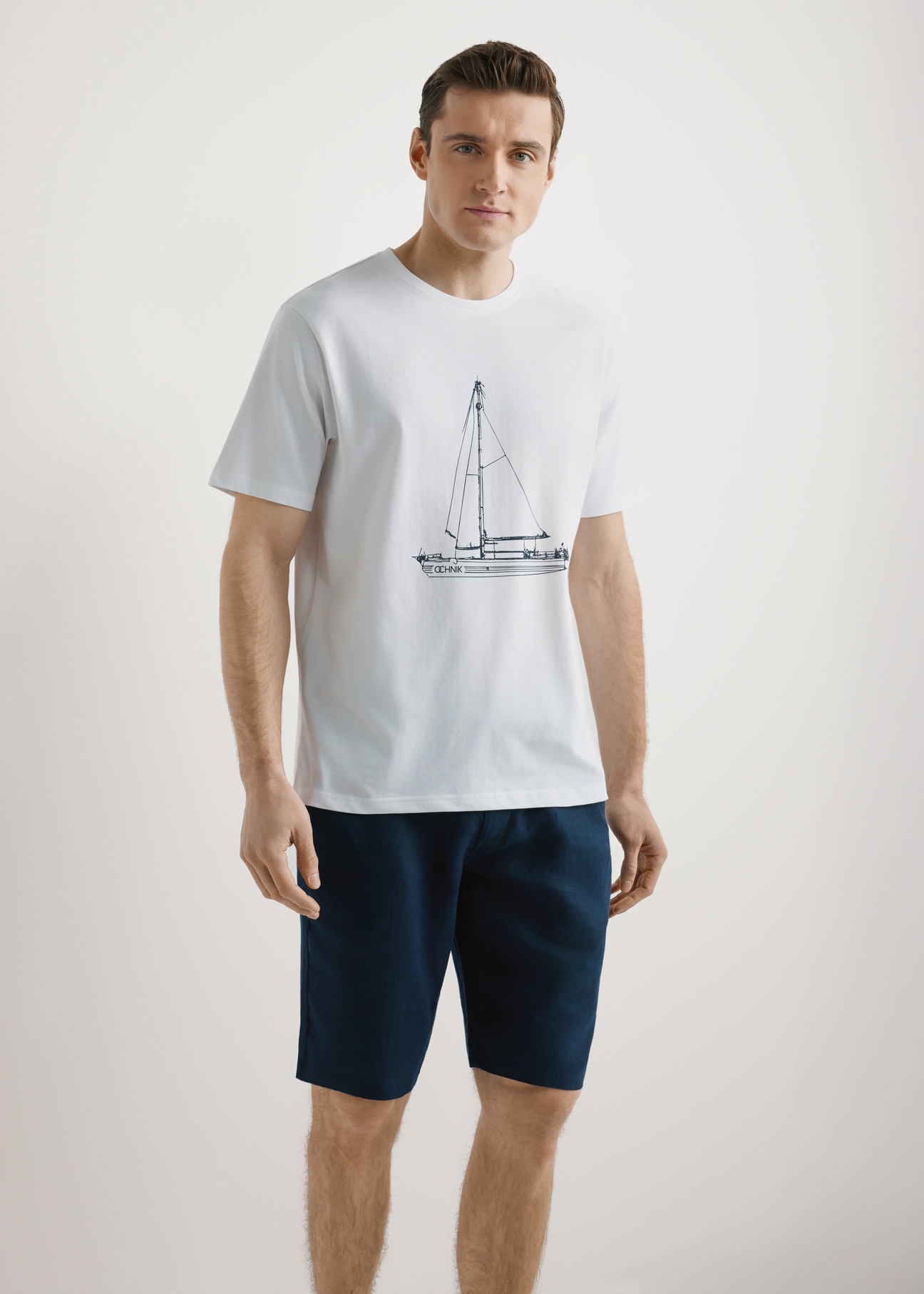 Men's white T-shirt with print TSHMT-0145-0A(W26), front view of the product on the model. Half of the silhouette visible.