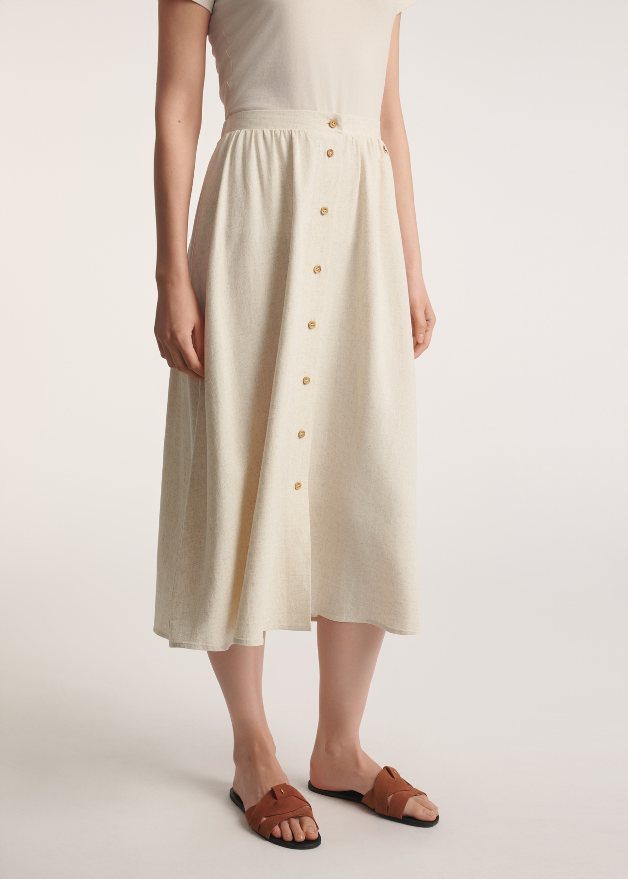 Beige midi skirt with linen SPCDT-0120-81(W25) - front product view on white background. Half of the silhouette visible.