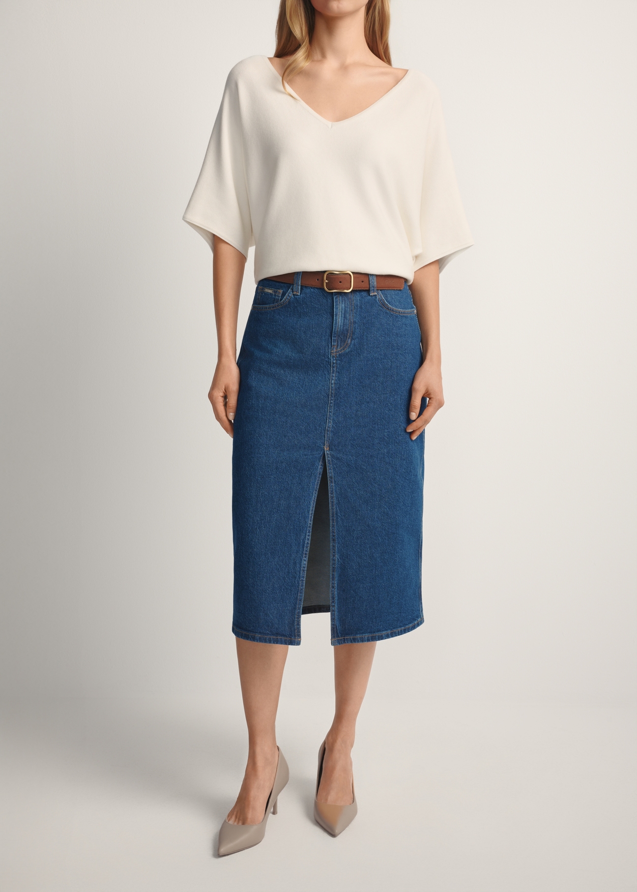 SPCDT-0119-7H(W26) denim midi skirt, front view of the product on the model. Half of the silhouette visible.