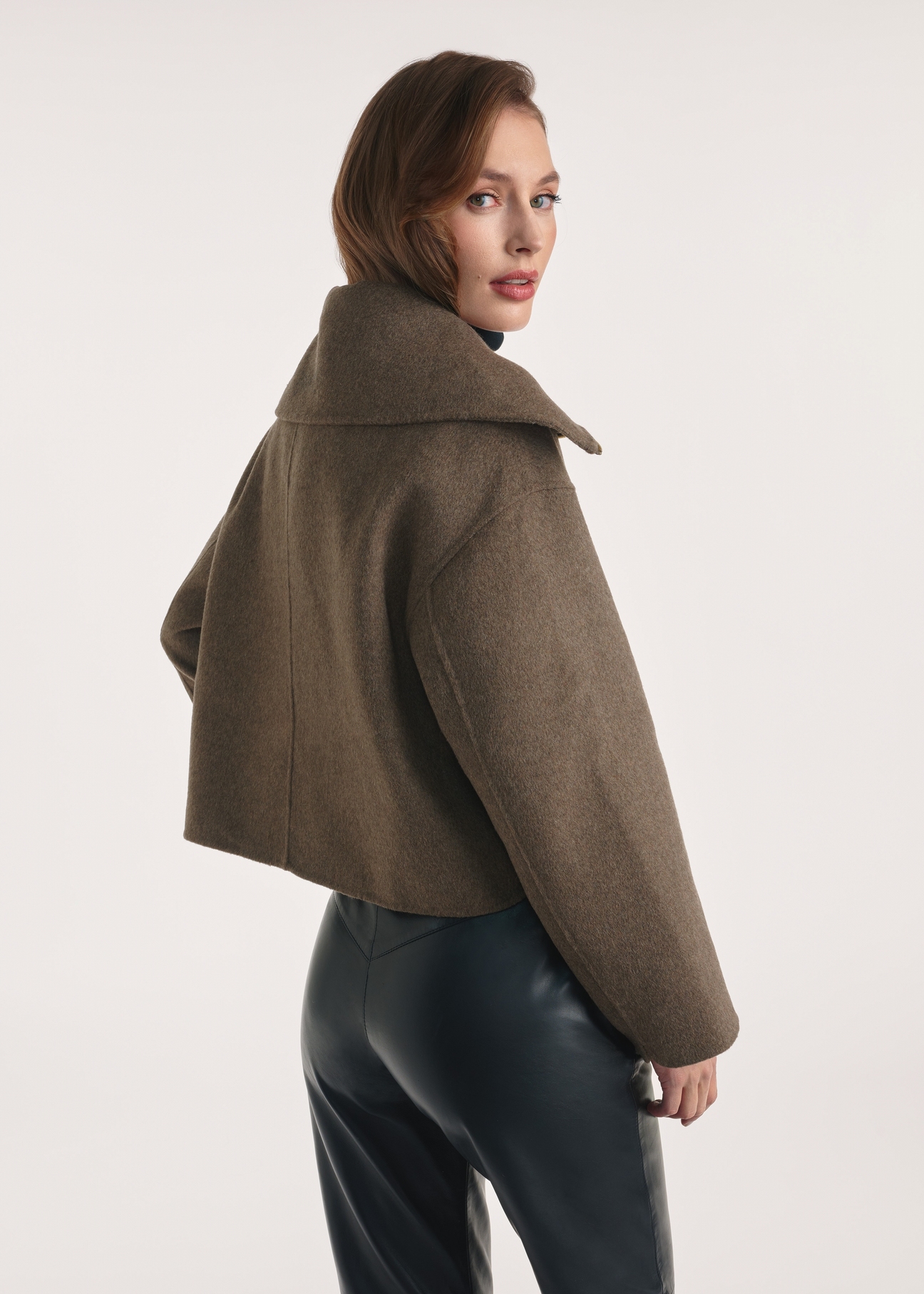 Short women's coat in brown color PLADT-0066-89(Z25), product view from the back on the model, half of the silhouette visible.