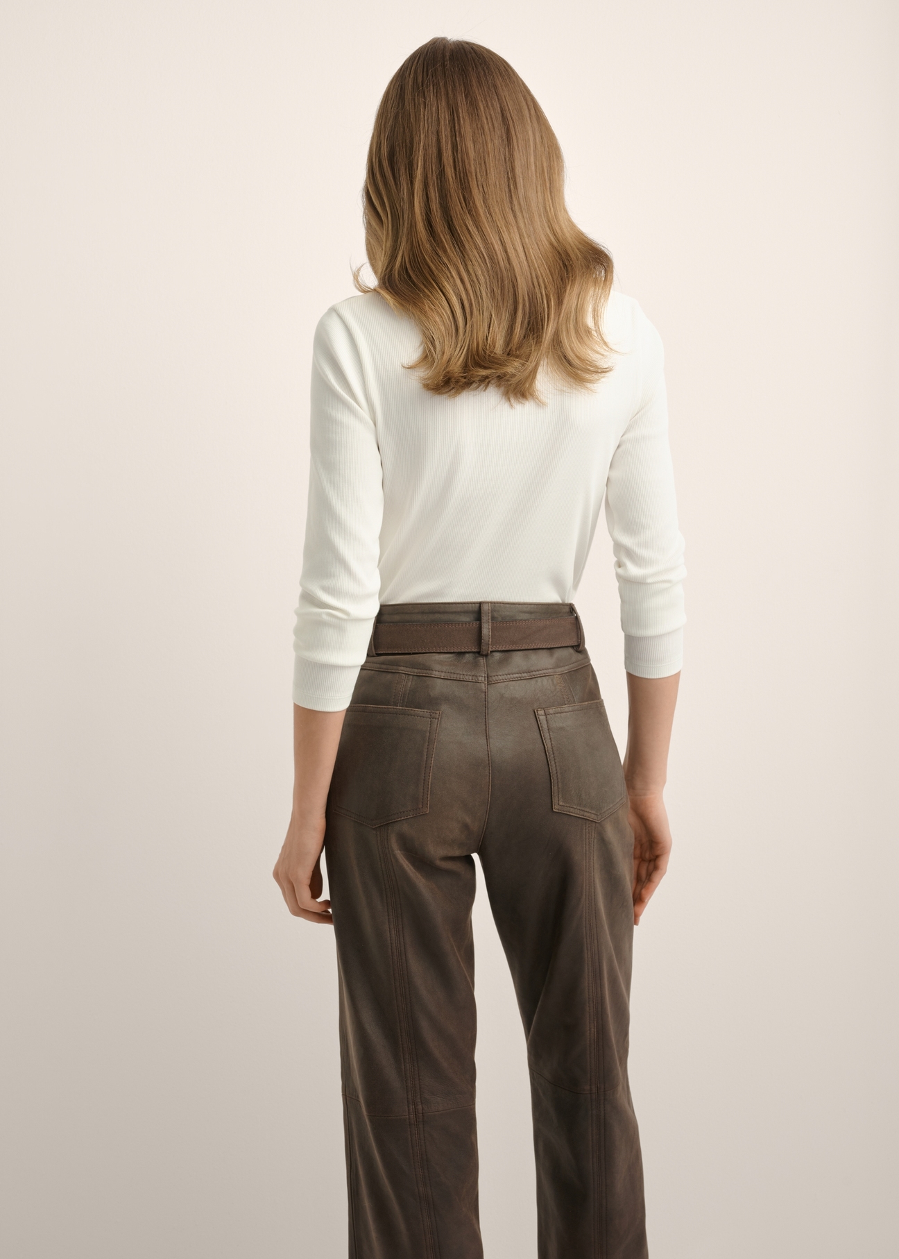 Cream ribbed women's blouse LSLDT-0059-0B(Z26), back view of the product on the model. Half of the silhouette visible.