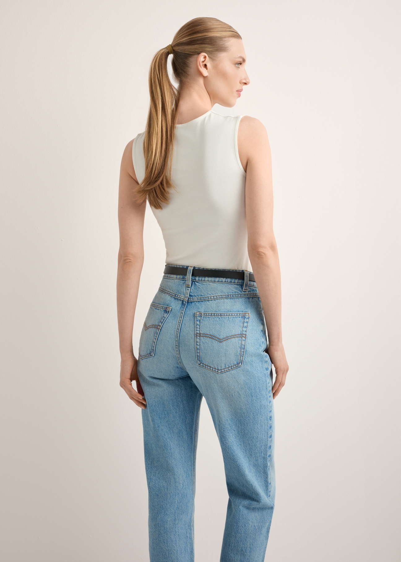 Women's white cotton blouse BLUDT-0211-0B(Z26), back view of the product on the model. Half of the silhouette visible.