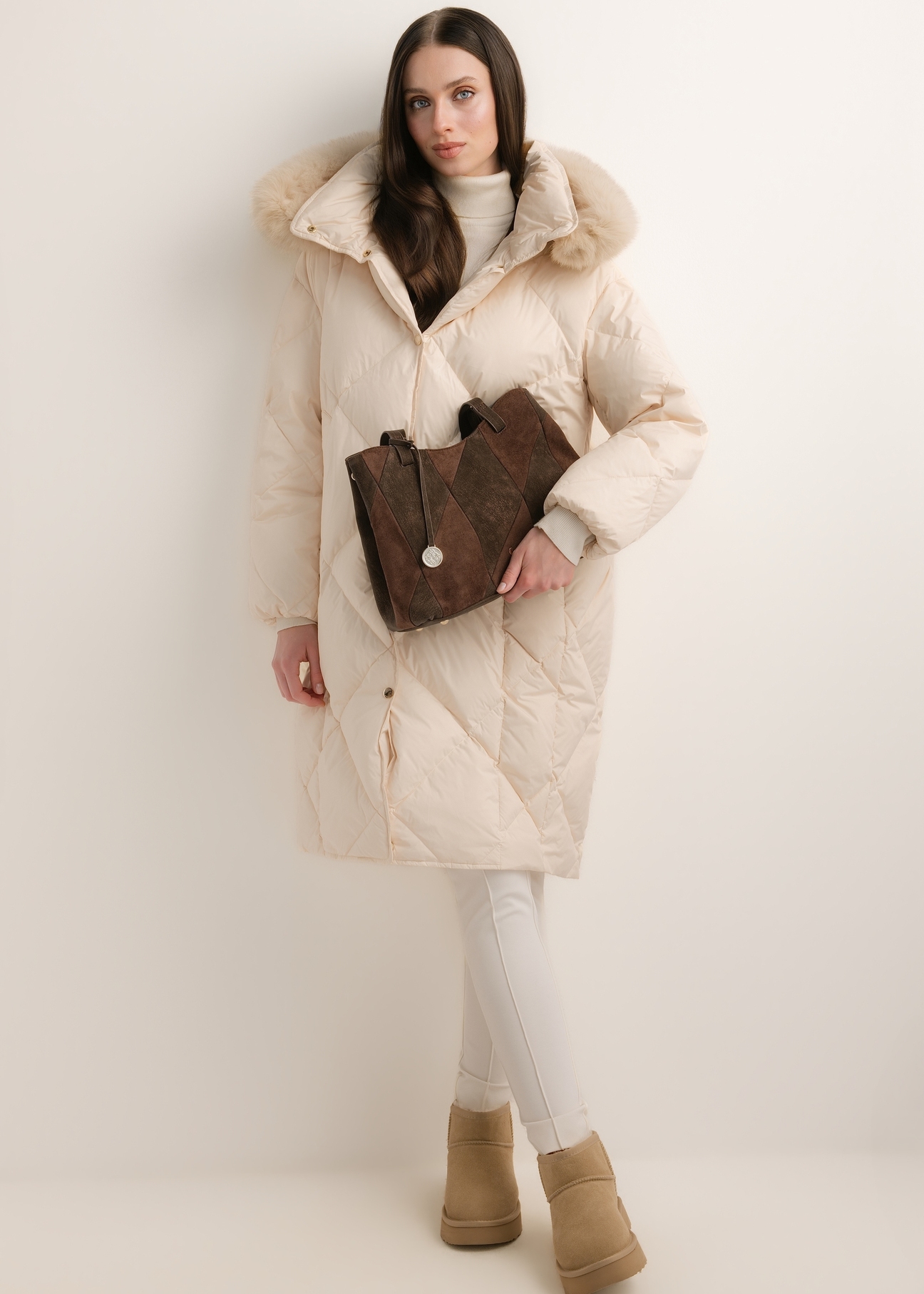 Brown women's shopper bag TOREC-1318-1H(Z26) – view of the product held in a model's hand against a light background; full-body shot.