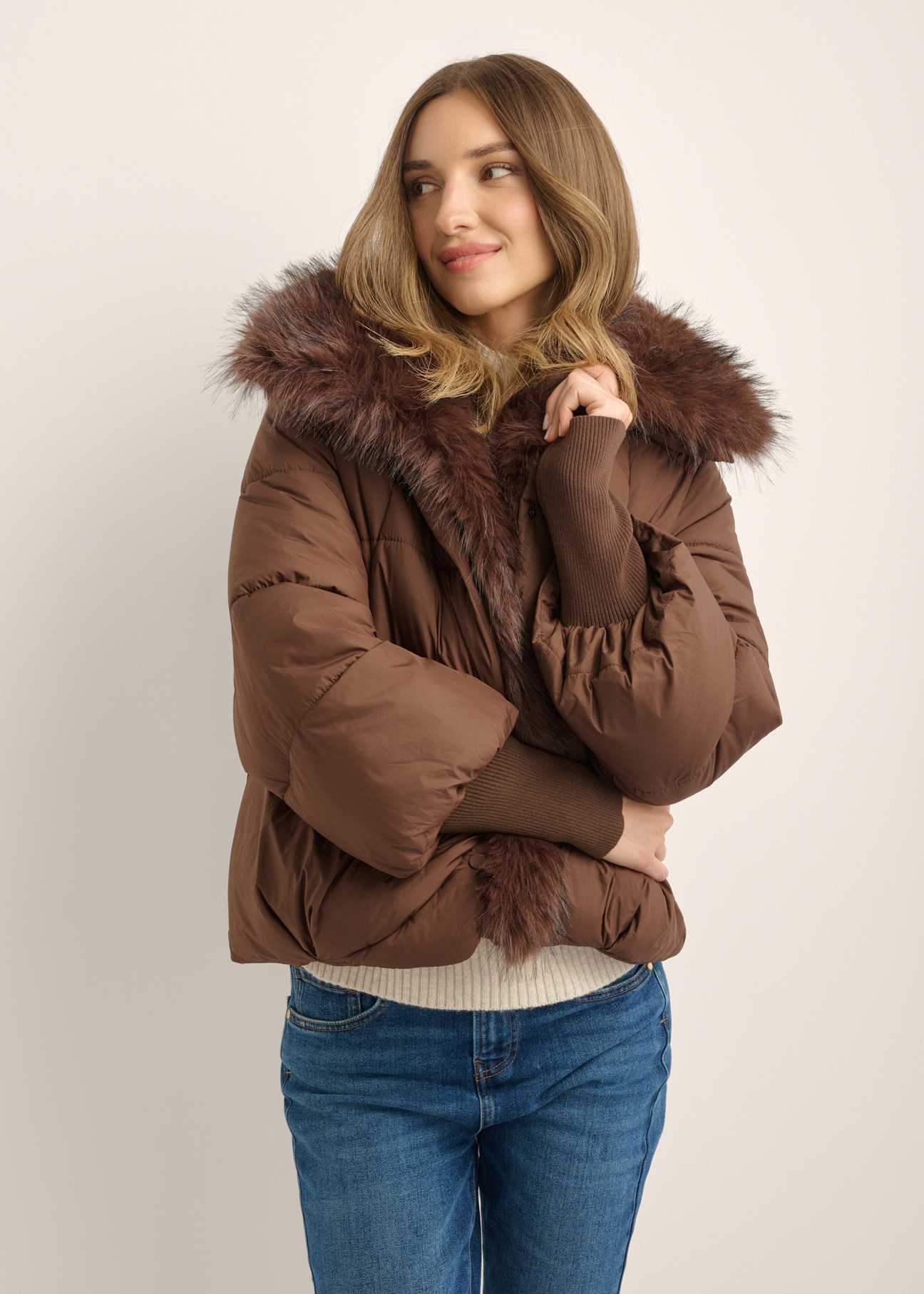 Women's brown jacket with detachable fur KURDT-0704-1H(Z26), front view of the product on the model. Half of the silhouette visible.