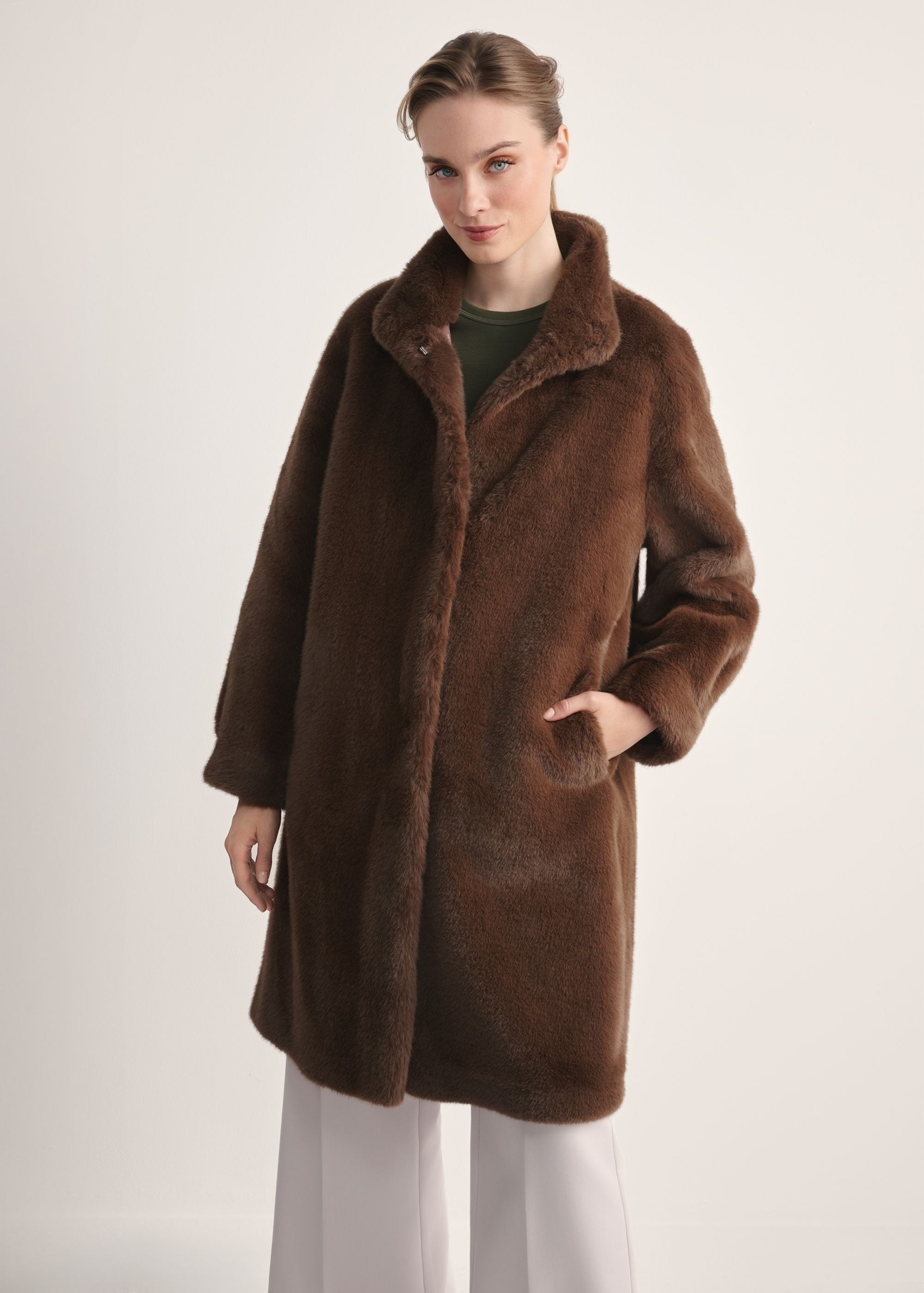 Elegant brown women's fur coat FUTDP-0050-89(Z25), front view of the product on the model, half of the silhouette visible.-02