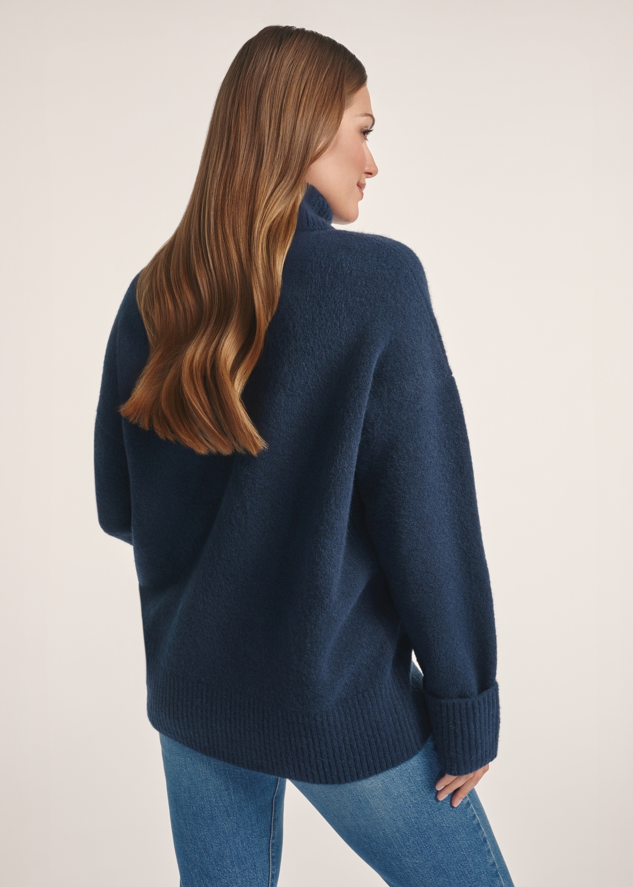 Navy blue women's turtleneck SWEDT-0249-68(Z25), product visible from the back on the model, half of the silhouette visible.