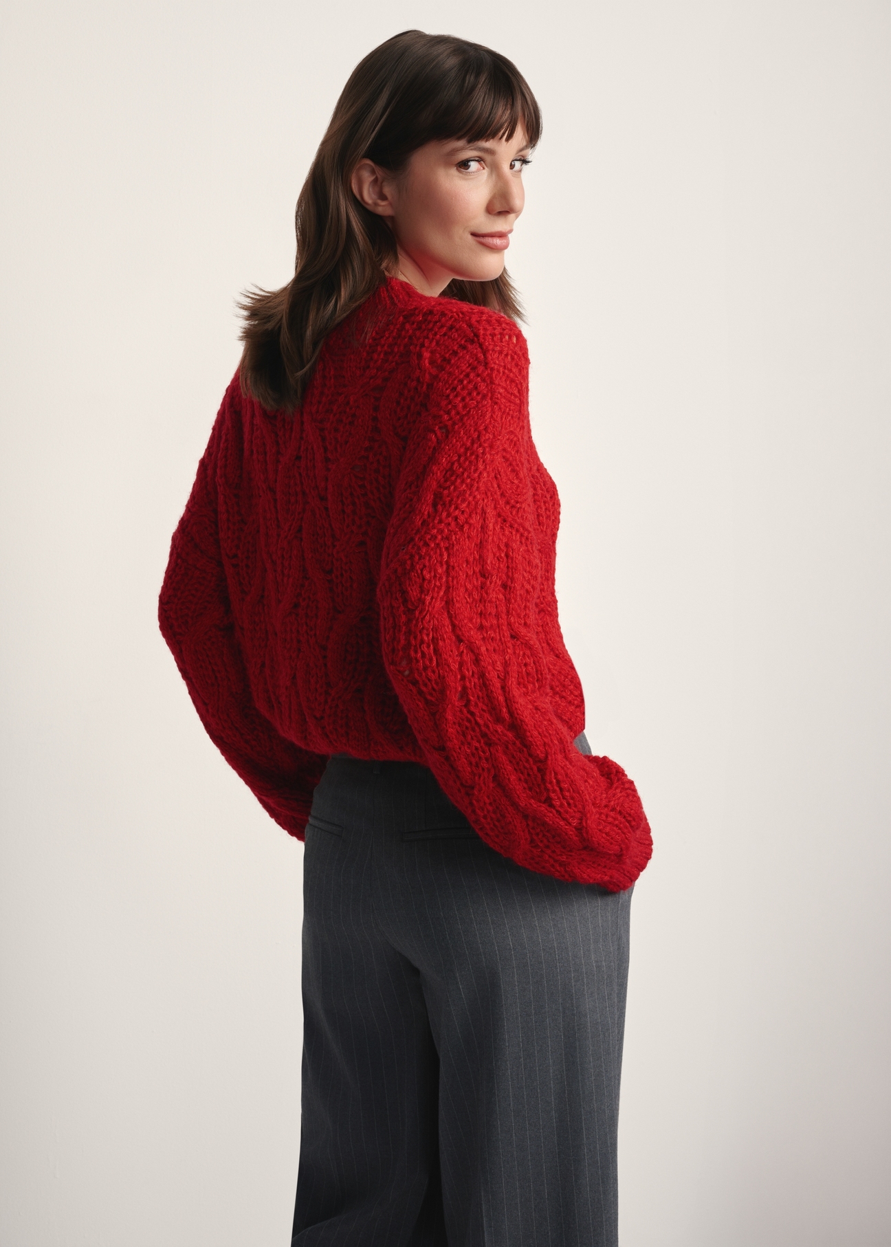 Red women's sweater SWEDT-0236-42(Z25), back view of the product on the model. Half of the silhouette visible.