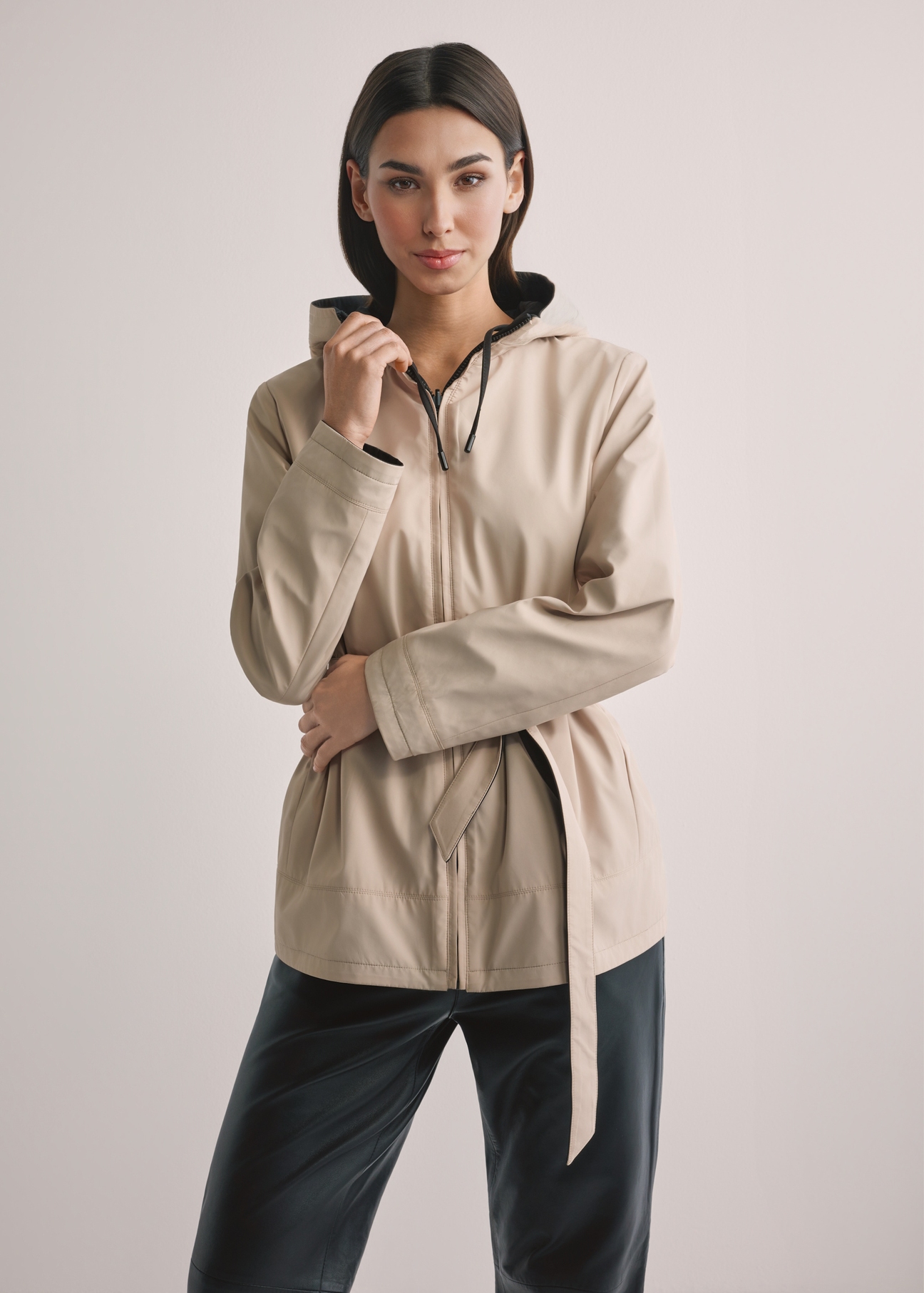 Women's reversible transitional jacket KURDT-0655-9J(W26), front view of the product on the model. Half of the silhouette visible.