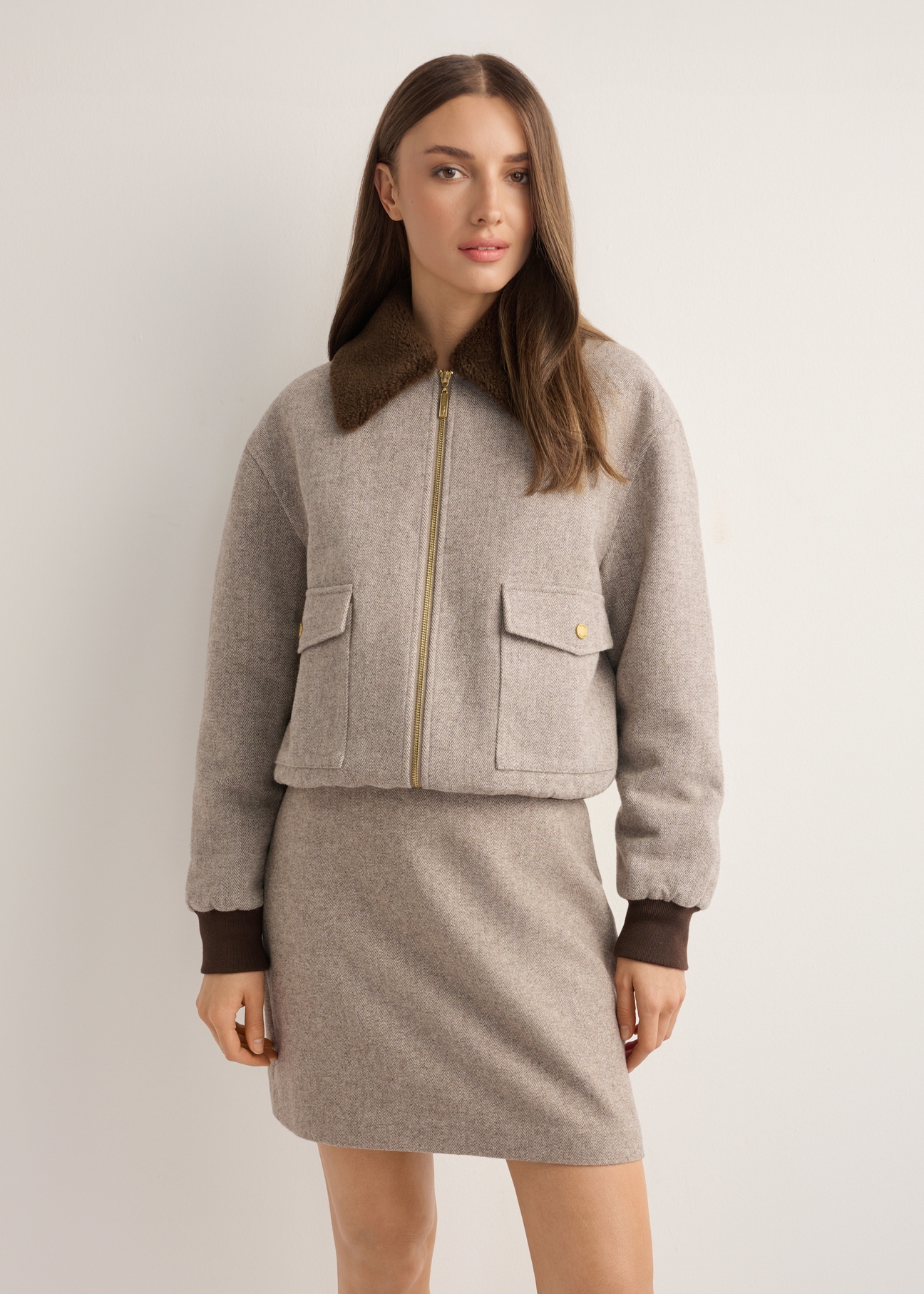 Women's short beige wool jacket PLADT-0077-1B(Z26), front view of the product on the model. Half of the silhouette visible.
