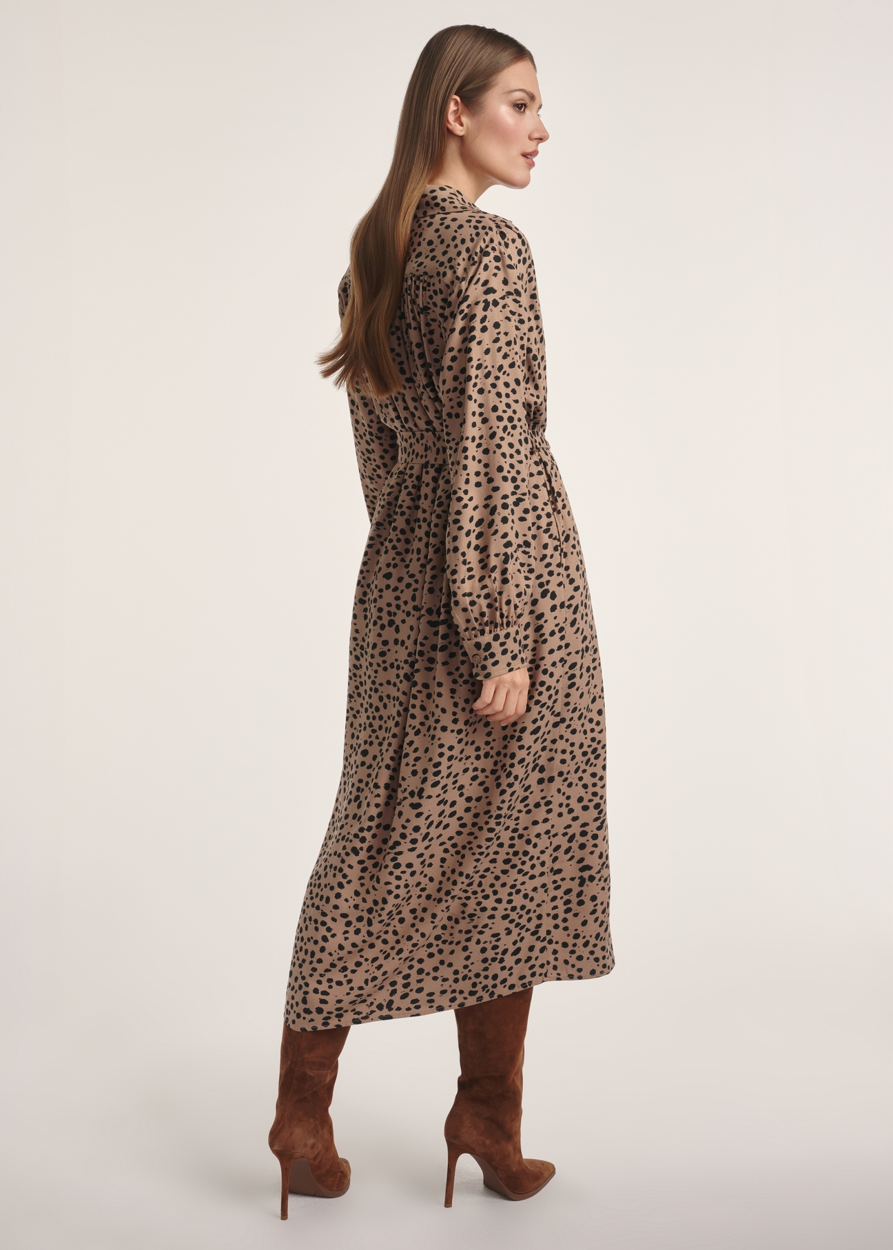 Dark beige long women's dress with spots SUKDT-0247-24(Z25), product view from the back on the model. The whole silhouette is visible.