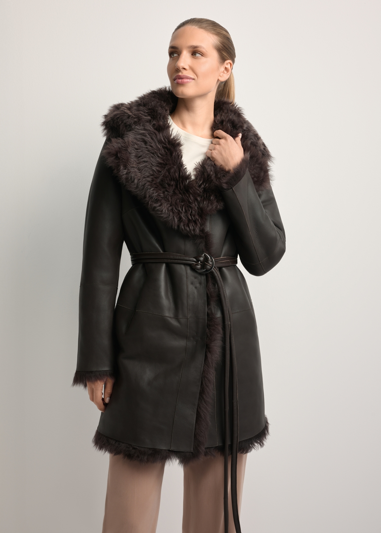 Women's brown double-sided leather sheepskin coat KOZDS-0090-1393(Z25), front view of the product on the model. Half of the silhouette visible.