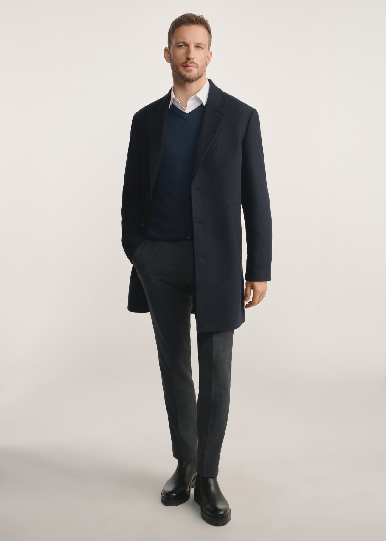 Navy blue men's coat PLAMT-0006-69(Z25), product visible from the front on the model, the entire silhouette is visible.