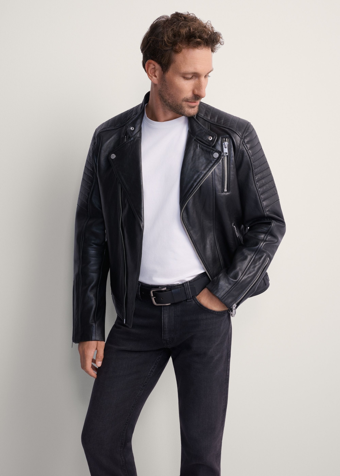 Men's leather biker jacket KURMS-0179L-5427(KS), front view of the product on the model. Half of the silhouette visible.