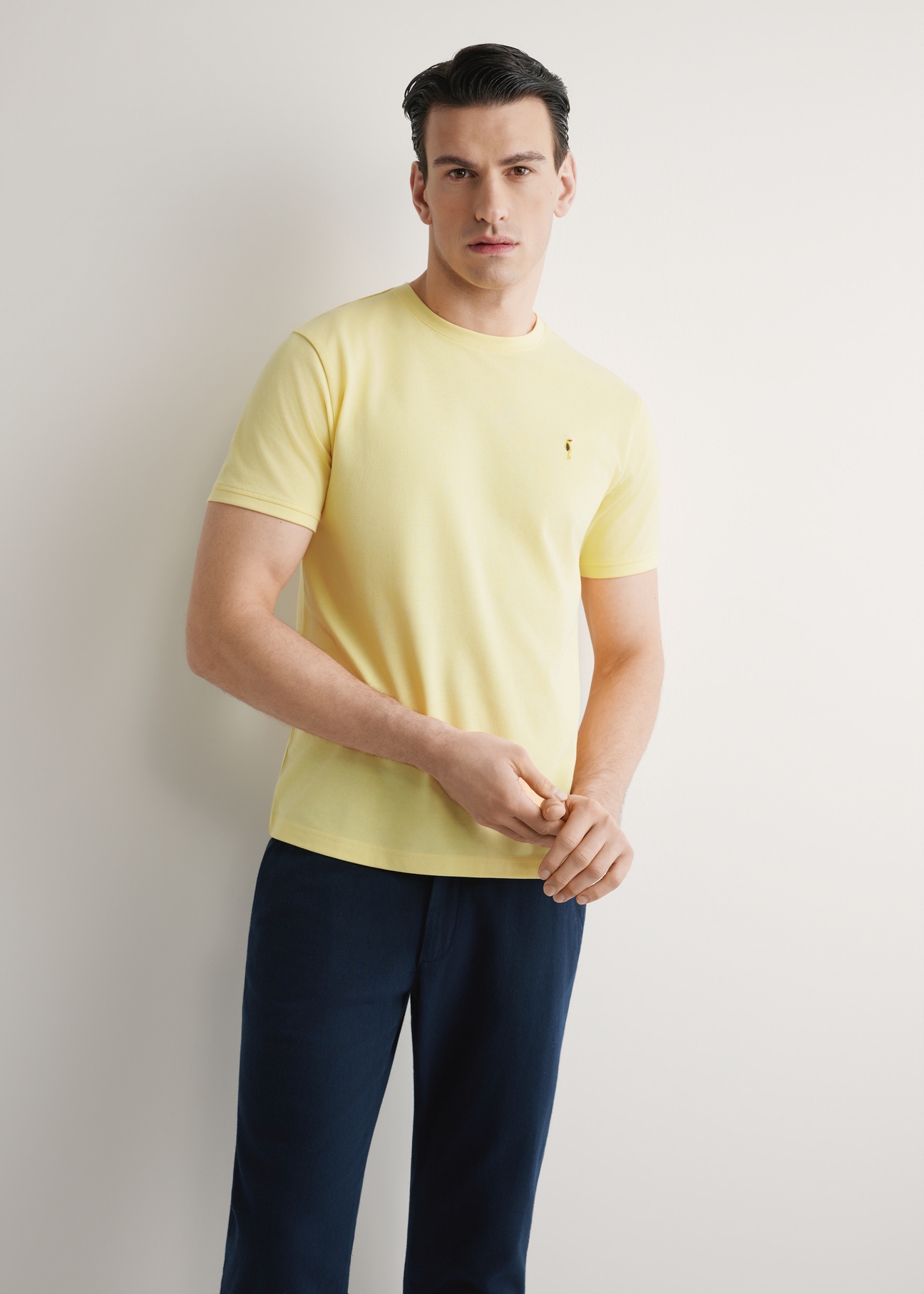 Men's yellow cotton t-shirt TSHMT-0136-2B(W26), front view of the product on the model. Half of the silhouette visible.