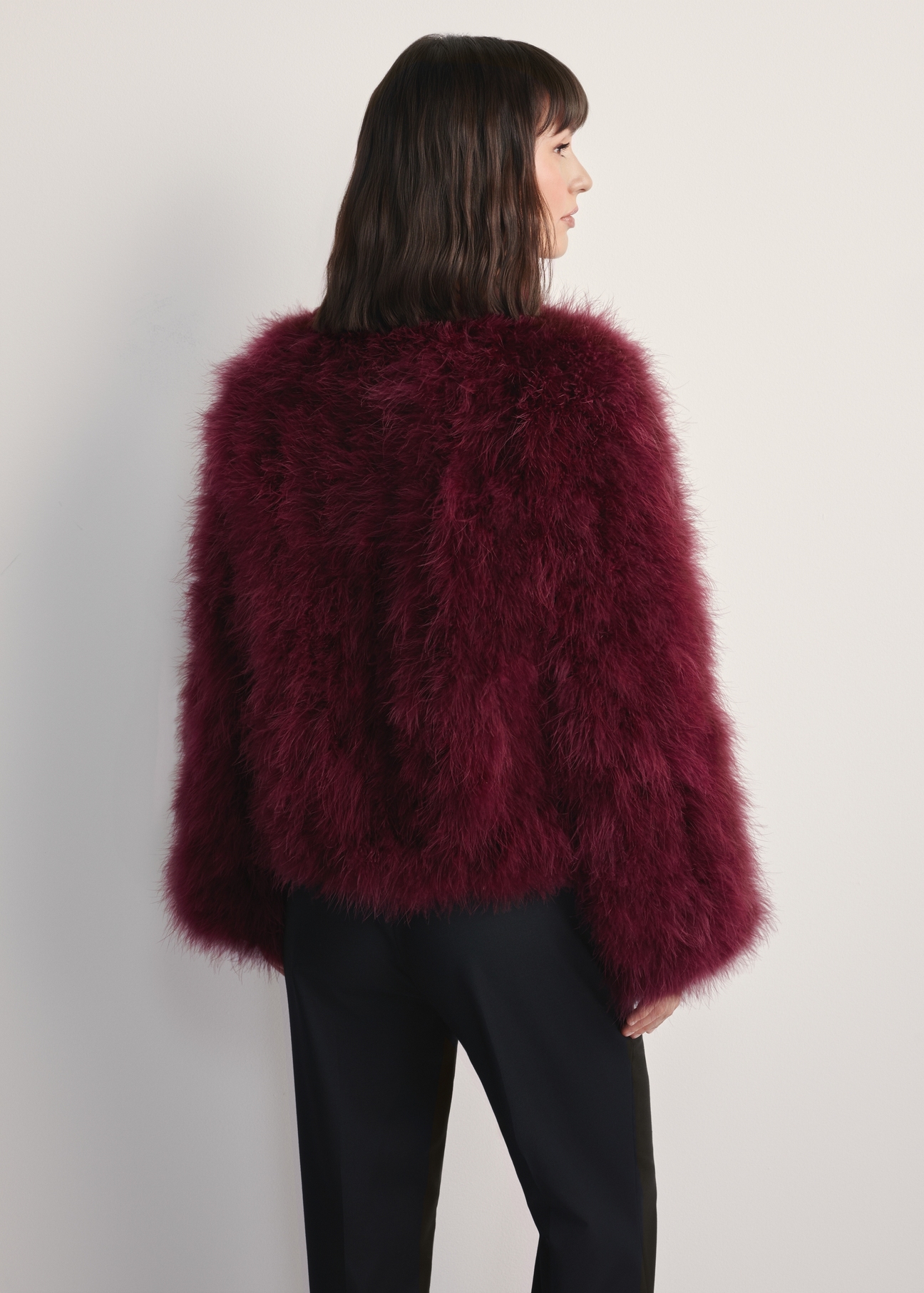 Women's turkey feather jacket FUTDF-0097A-3183(Z25), back view of the product on the model. Half of the silhouette visible.