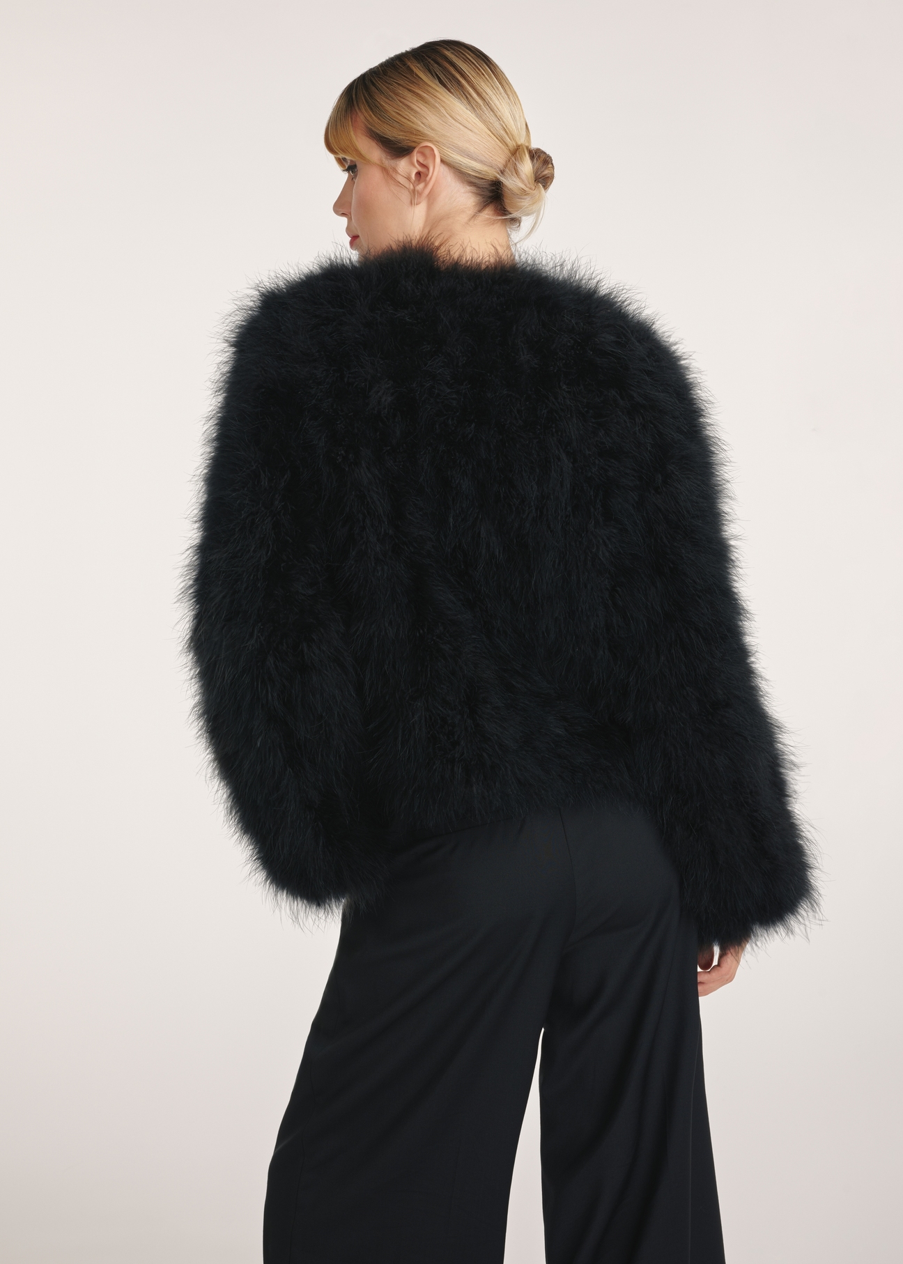 Women's turkey feather jacket FUTDF-0097A-1270(Z24), product view from the back on the model, half of the silhouette visible.
