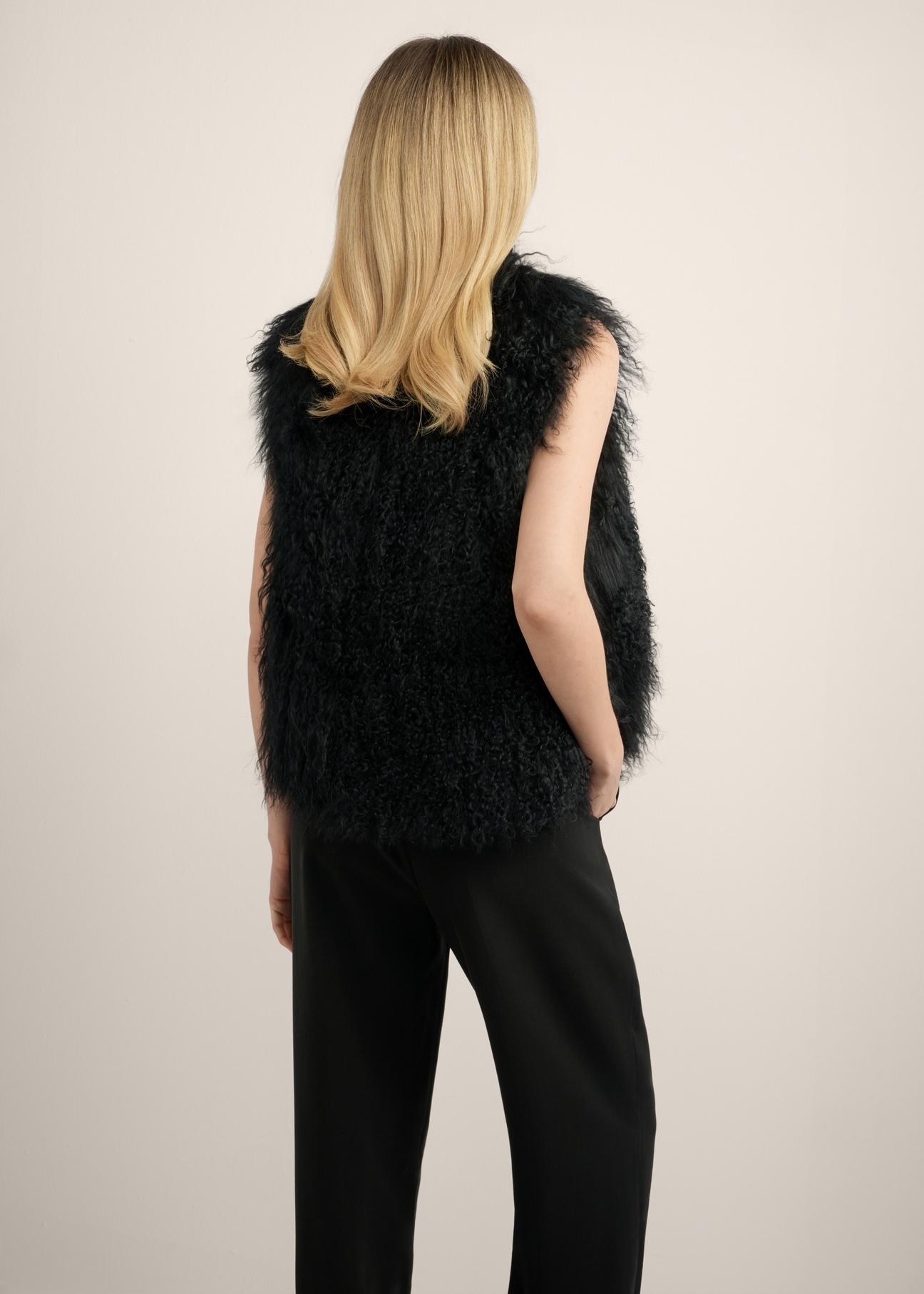 Women's black vest KAMDF-0061-99(Z26) - back view of the product, on a model, against a light background. Knee-length silhouette visible.