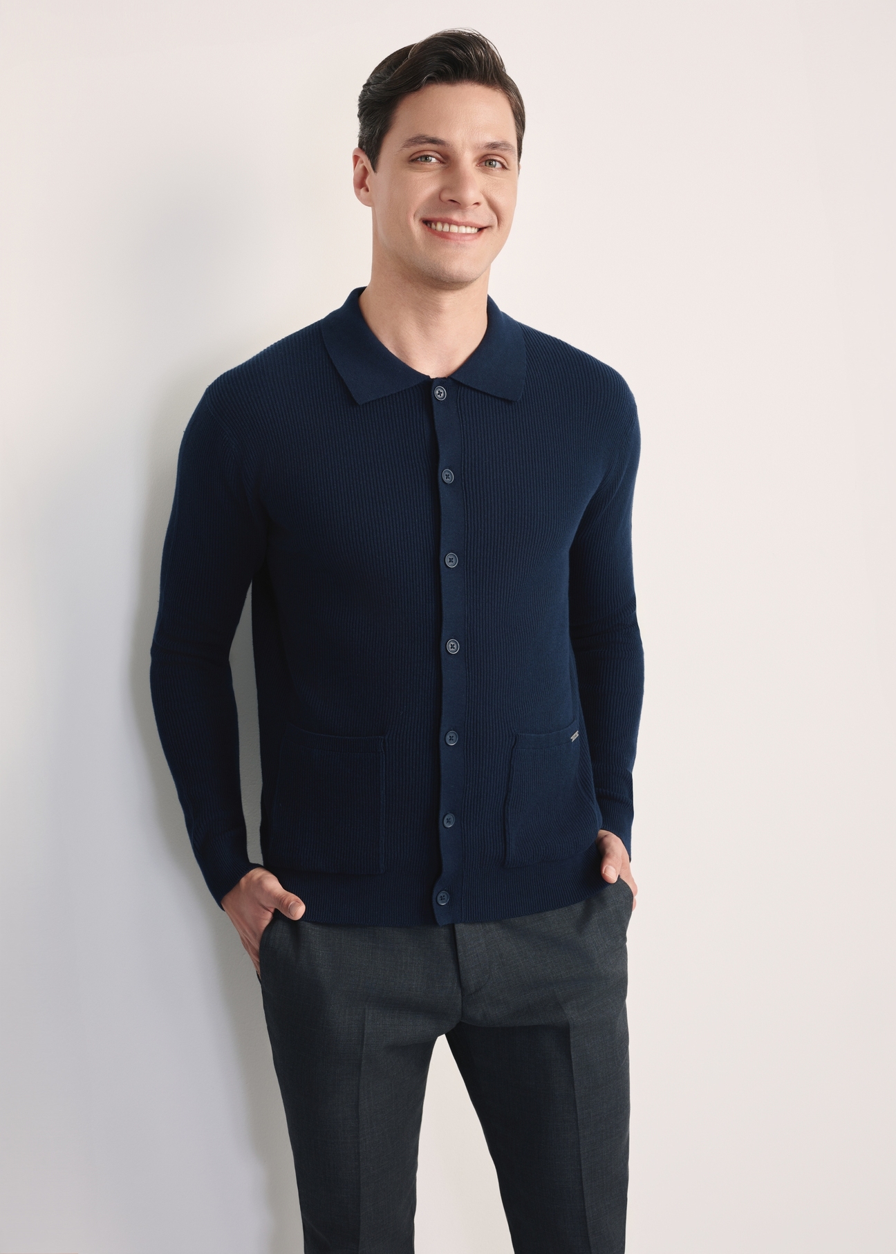Navy blue men's cardigan KARMT-0004-68(Z25), front product view on the model. Half of the silhouette visible.