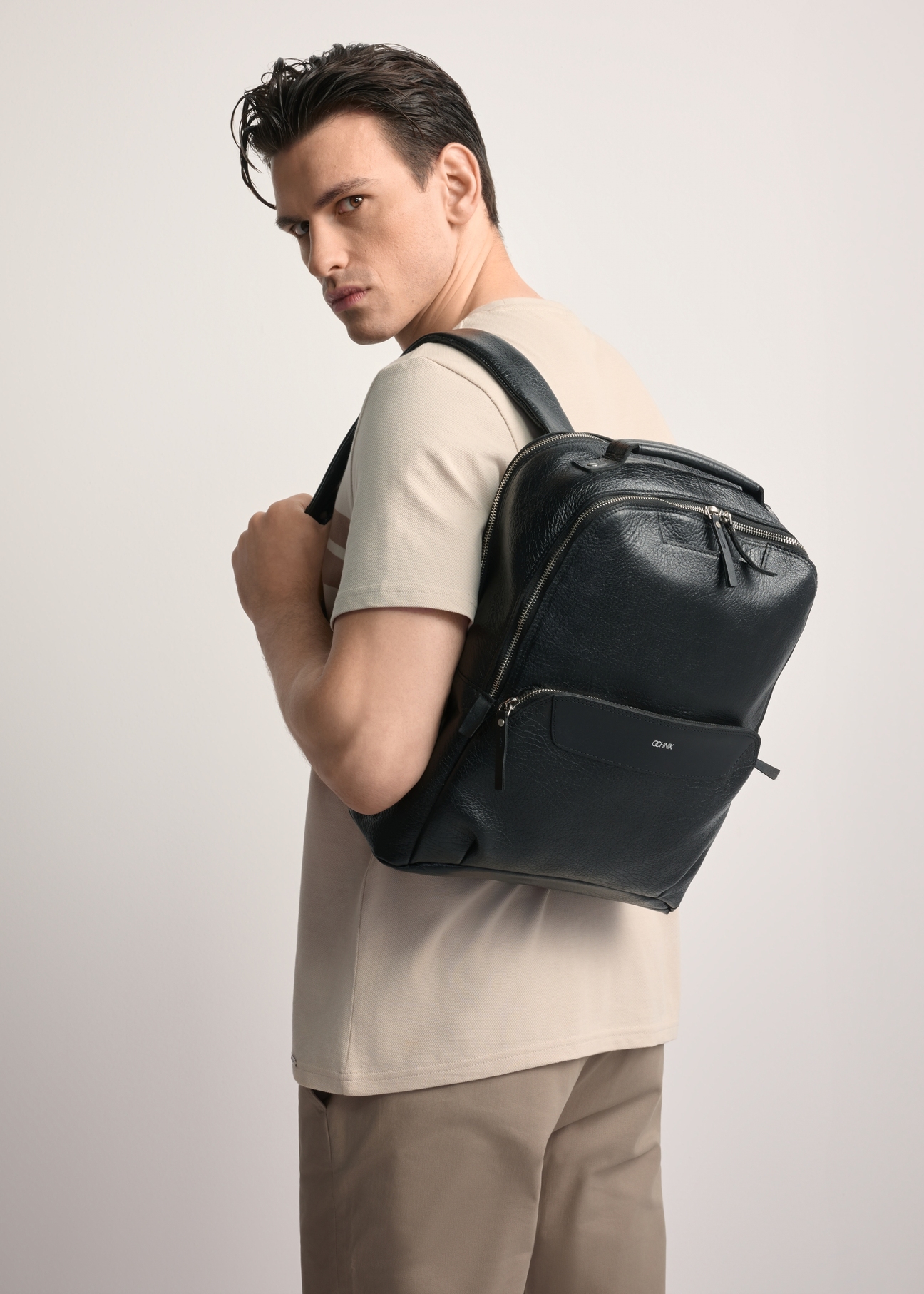 Large black leather men's backpack PLCMS-0019A-99(Z25), product view on the model's silhouette.