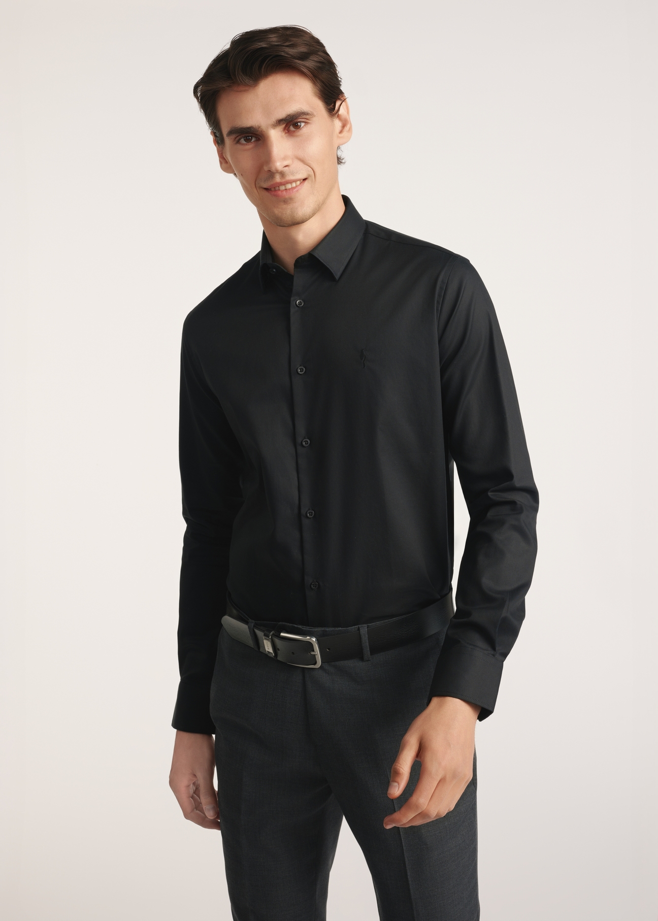 Black men's shirt KOSMT-0351-99(Z25) - front view of the product on a model on a white background. Half of the silhouette visible.