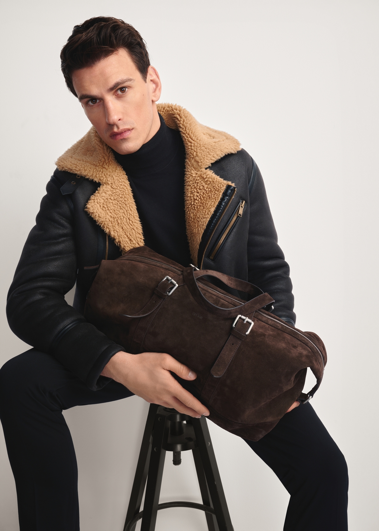 Chocolate leather men's bag TORMS-0476-90(Z25), front view of the product on the model, half of the silhouette visible.