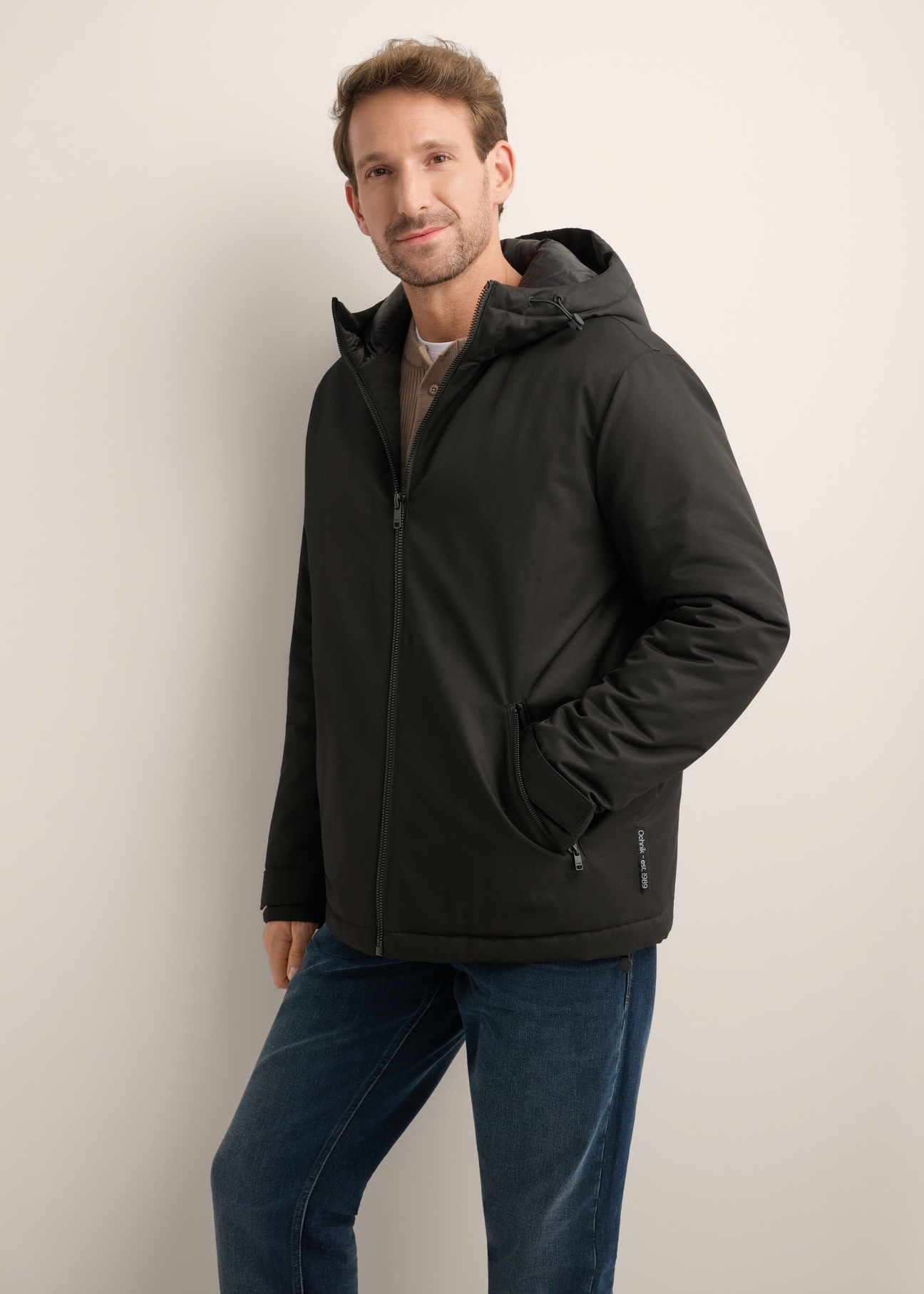 Black men's transitional jacket KURMT-0436-99(Z26), front product view on model. Half silhouette visible.