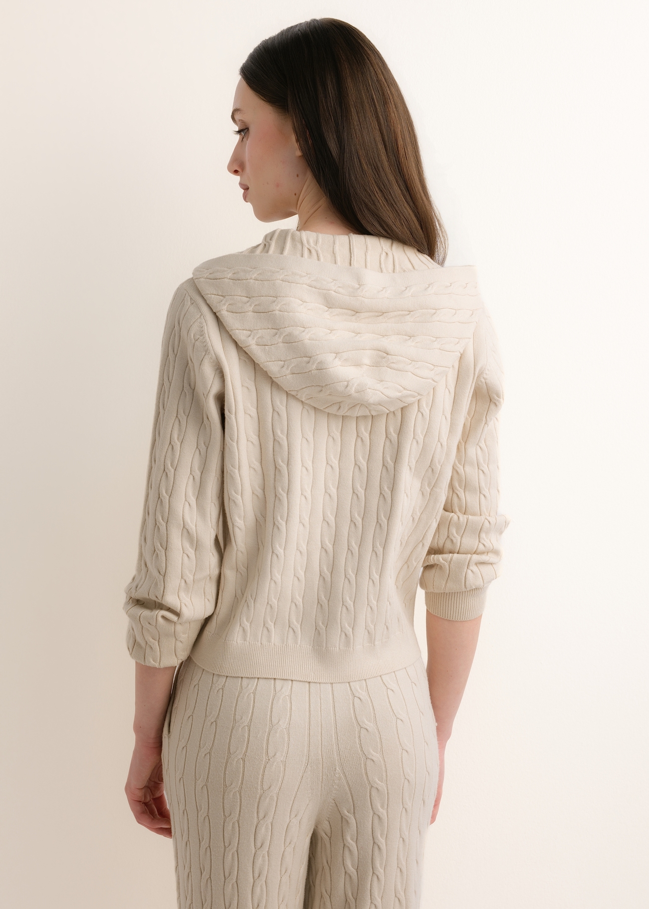 Beige women's hooded sweater BLZDT-0124-1A(Z26), rear view on a model. Half-body shot.