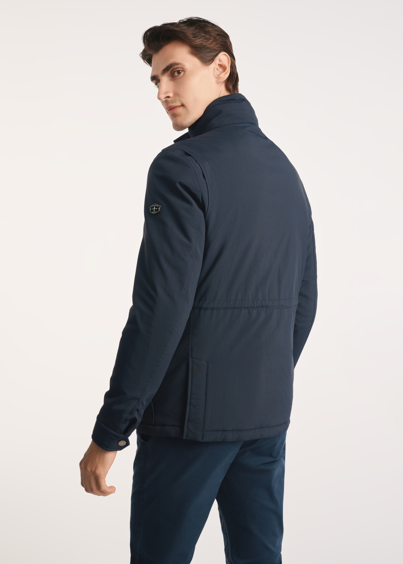 Navy blue men's jacket KURMT-0398-69(Z25), product visible from the back on the model, half of the silhouette visible.