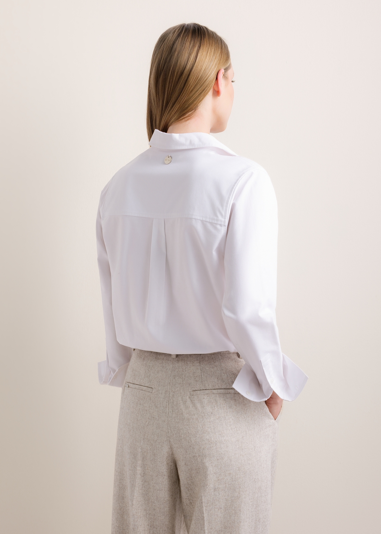 Women's long-sleeved white shirt KOSDT-0196-0A(Z26), rear view on a model. Half-body shot.