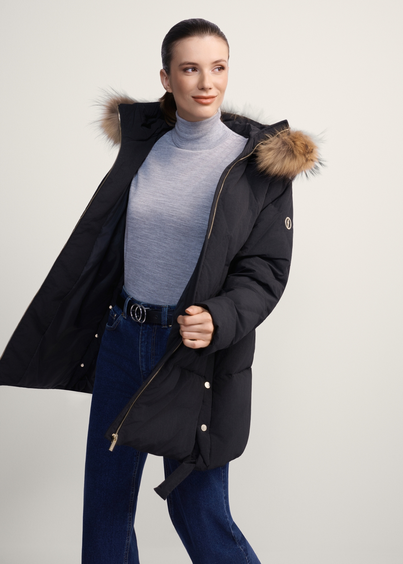 Black women's jacket with fur KURDT-0480-99(Z25), product view from the front on the model, half of the silhouette visible.