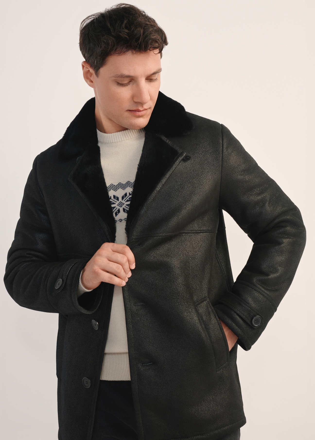 Black men's sheepskin coat made of genuine leather KOZMS-0026-3191(Z25) - front view of the product, on a model, against a white background. Half of the silhouette visible.