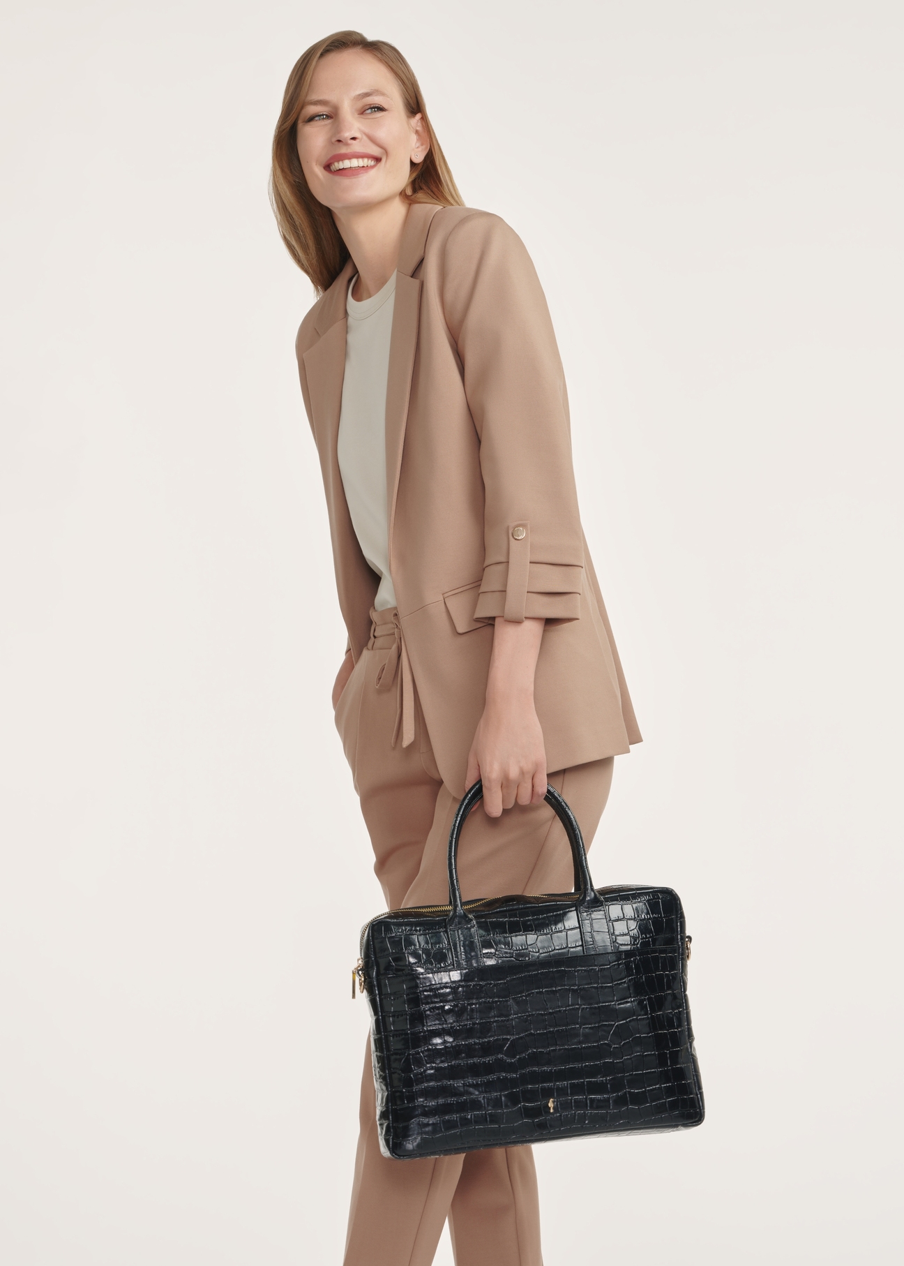 Elegant women's leather croco bag TORES-1128E-99(Z25), product view from the front with a model, half of the silhouette visible.