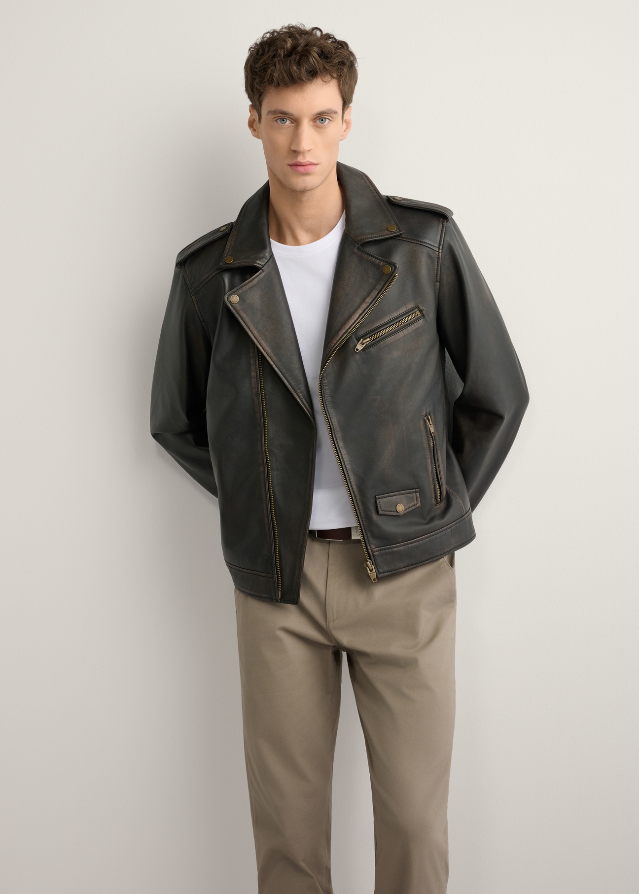 Men's leather biker jacket KURMS-0395-99(W26) - front view of the product, on a model, against a light background. Full silhouette visible.