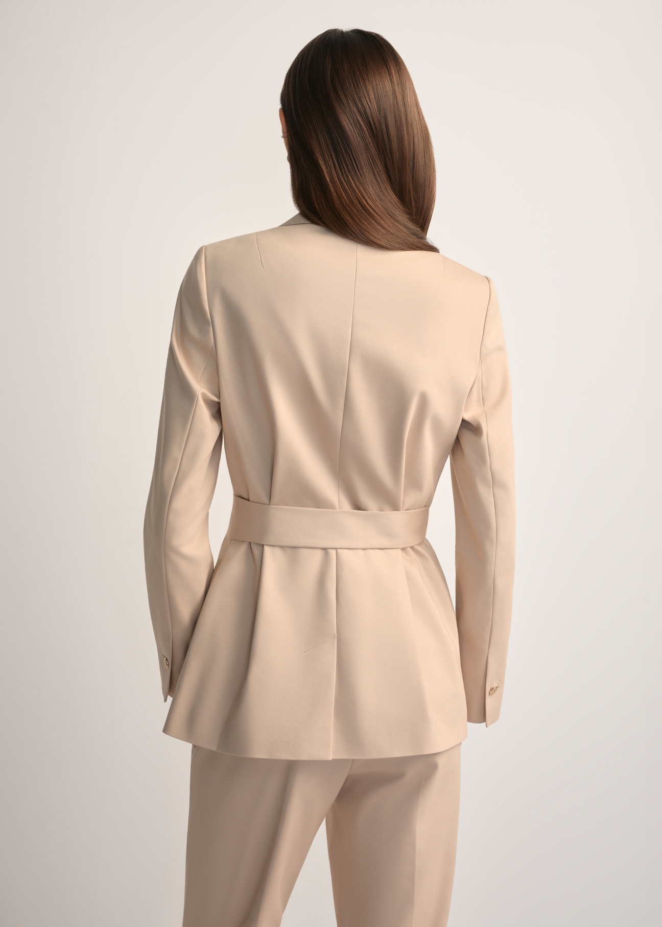 Beige women's belted blazer ZAKDT-0030-1B(W26), back view of the product on the model. Half of the silhouette visible.