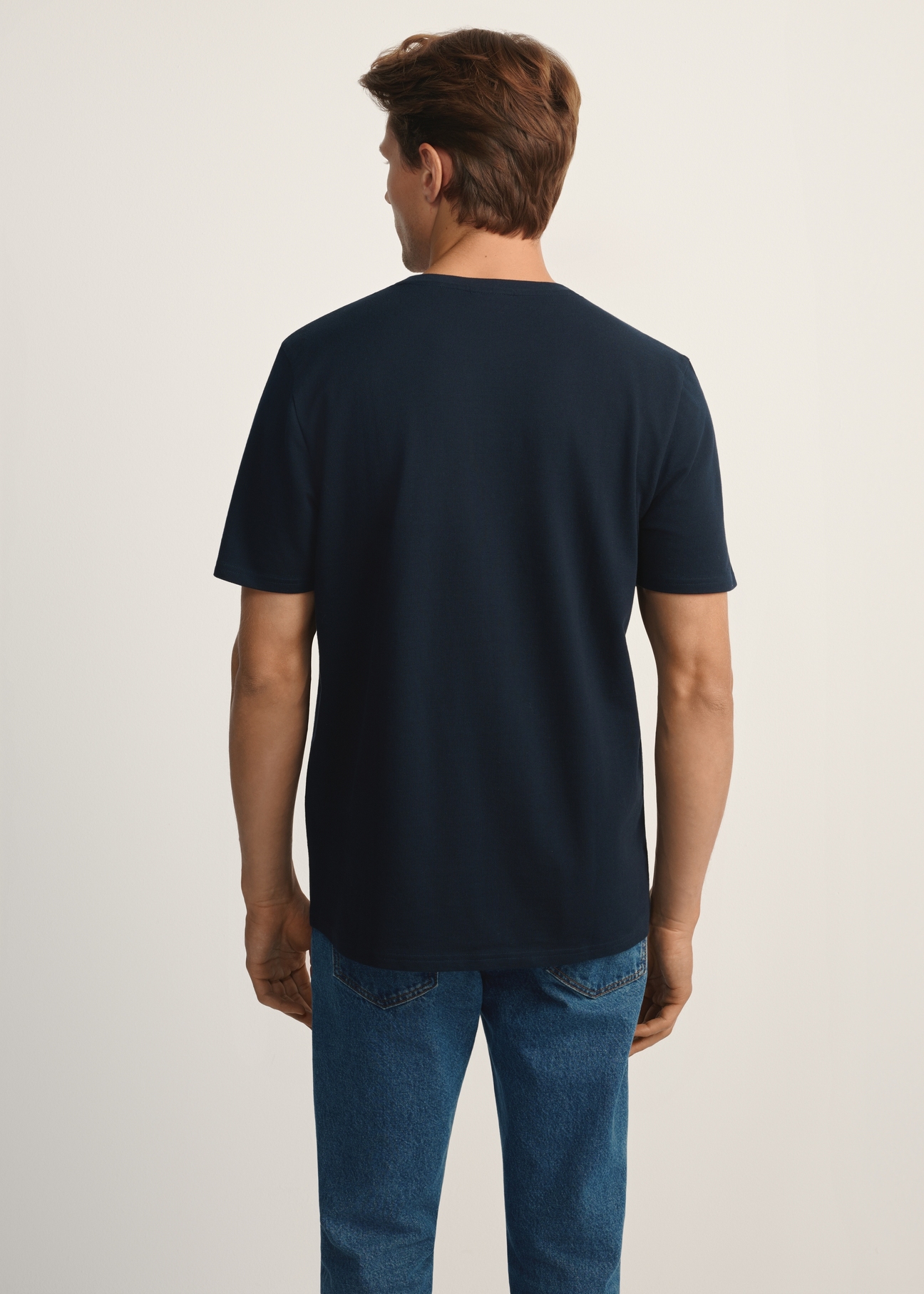 Navy blue cotton men's t-shirt TSHMT-0129-68(Z25), product view from the back on the model, half of the silhouette visible.