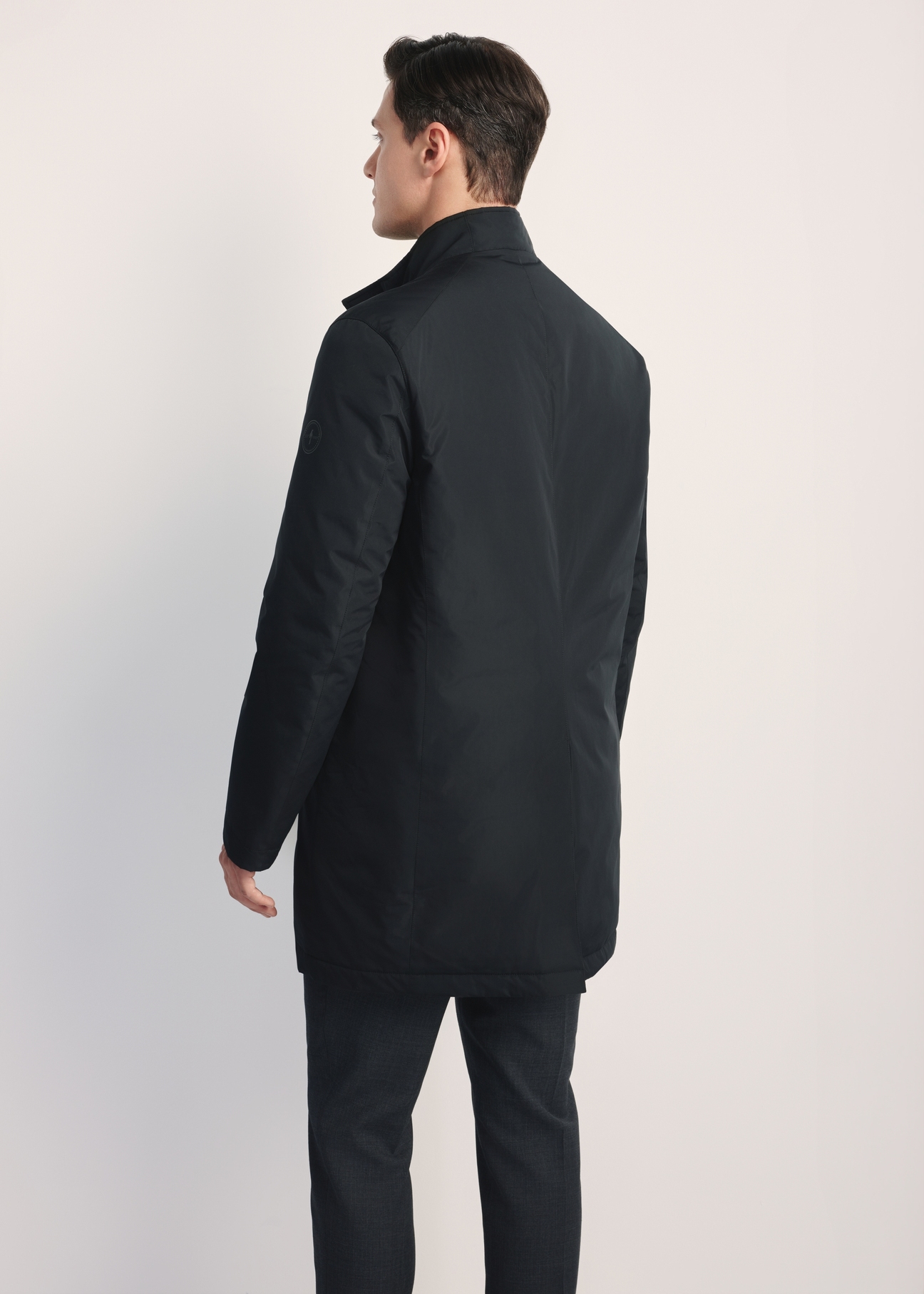 Black men's transitional jacket KURMT-0388-99(Z25), product visible from the back on the model, half of the silhouette visible.